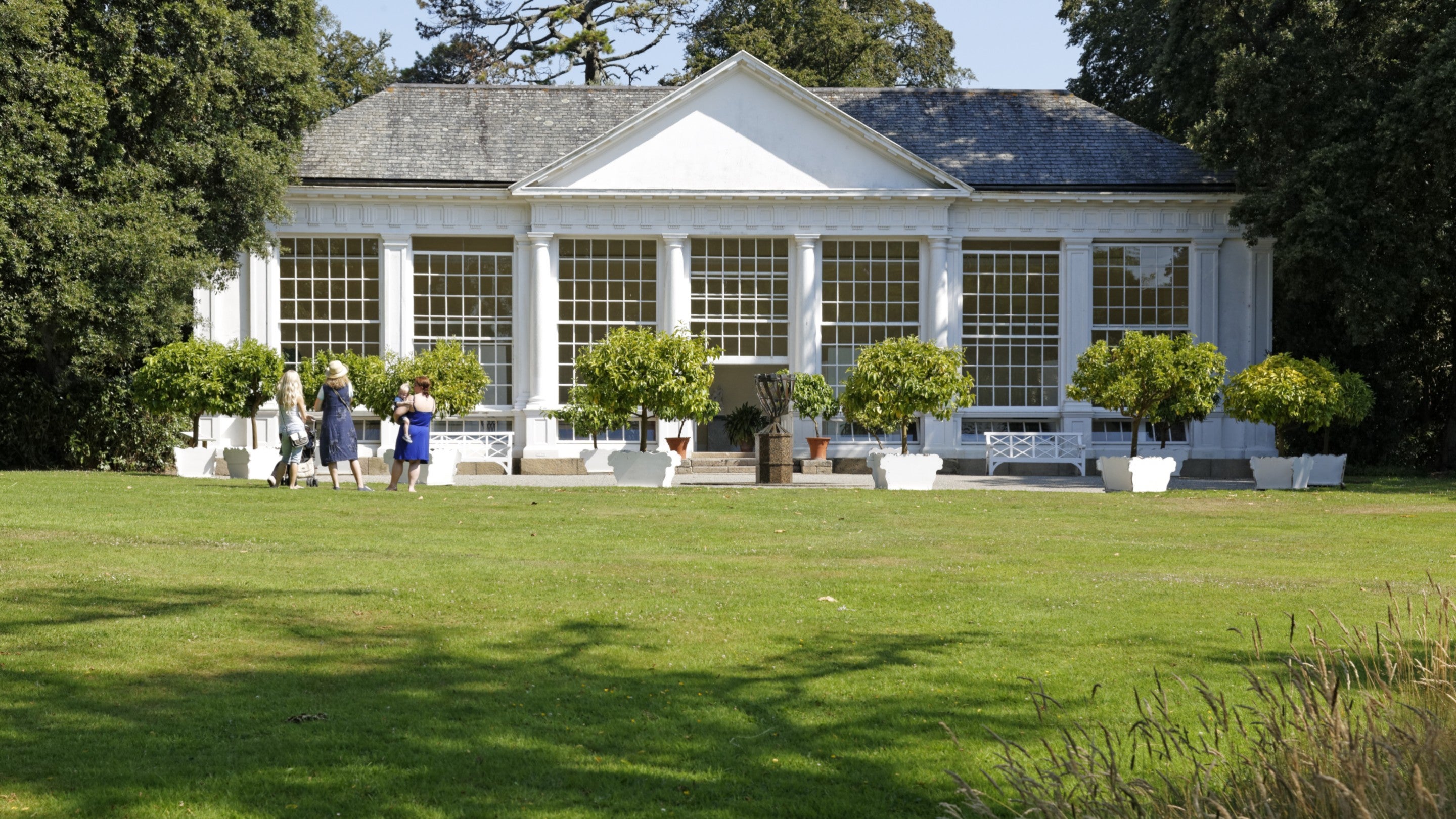 The white exterior of the orangery at Saltram on a sunny day