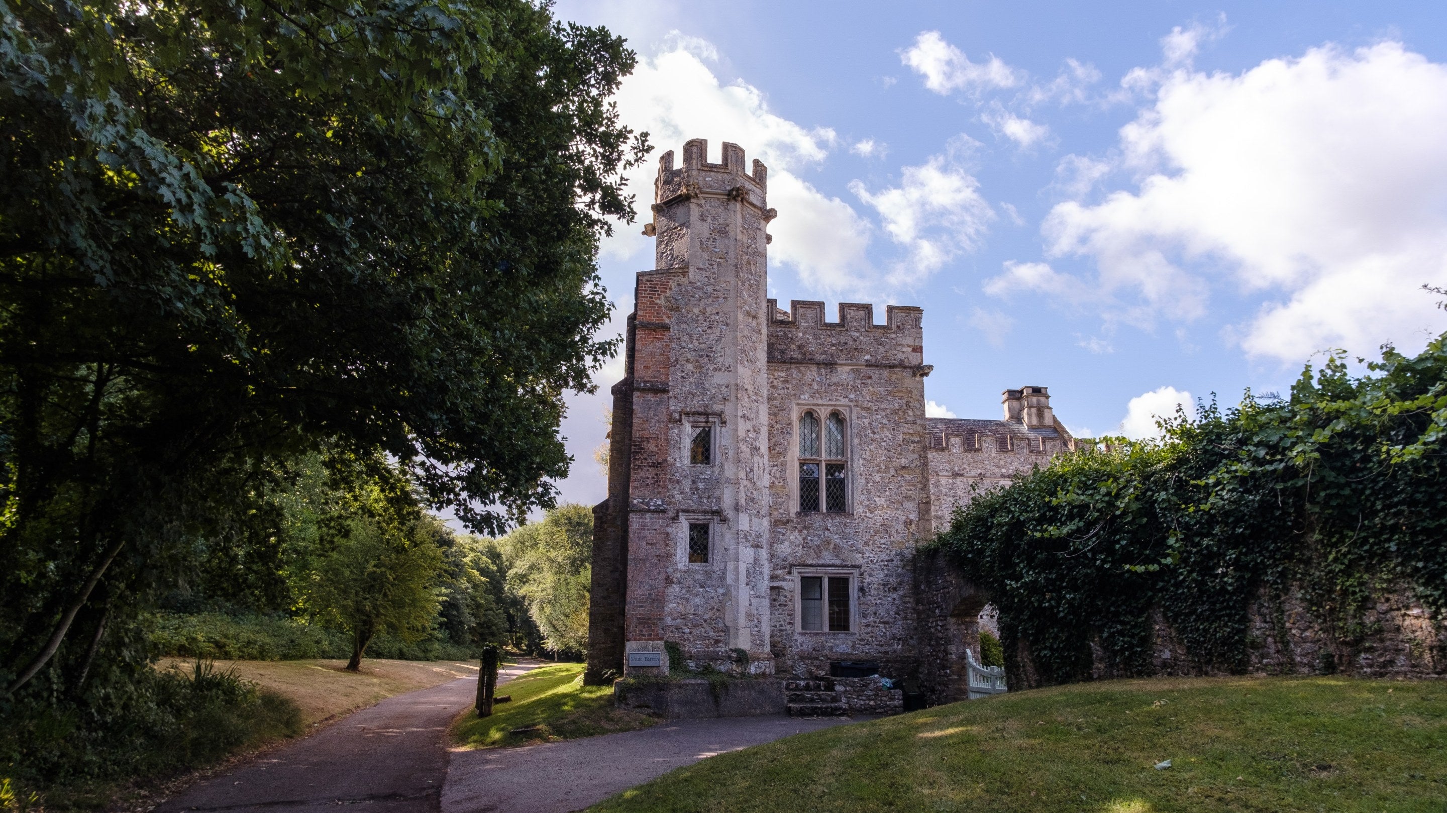 The exterior of Shute Barton showing the staircase tower and driveway