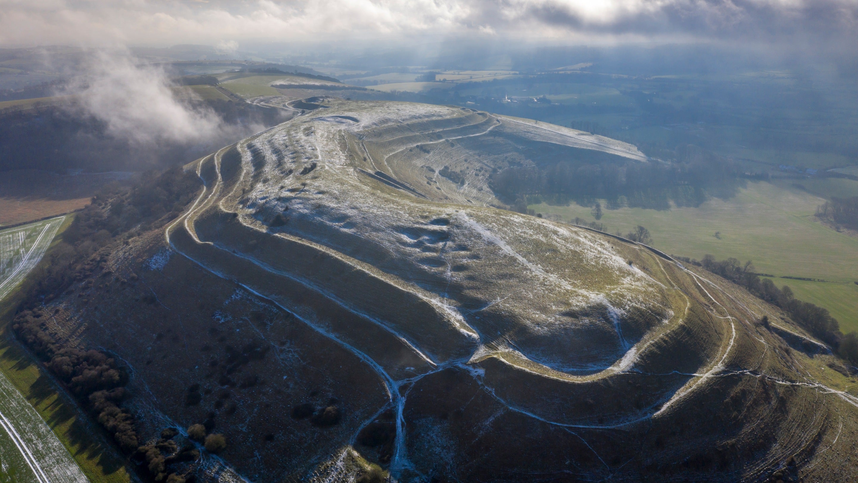 An aerial view of Hambledon Hill and the surrounding countryside, Dorset in winter