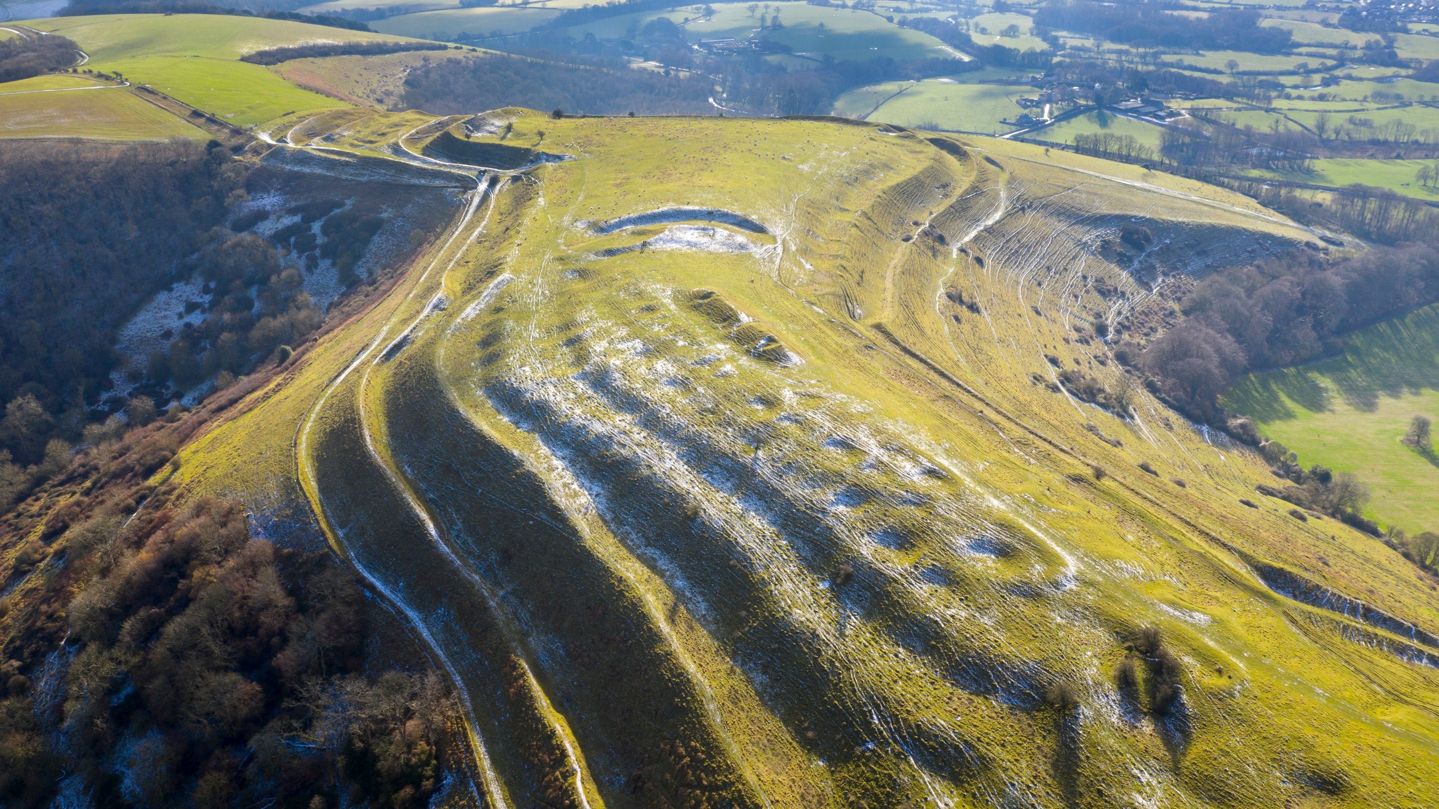An aerial view across Hambledon Hill with light frost, Dorset