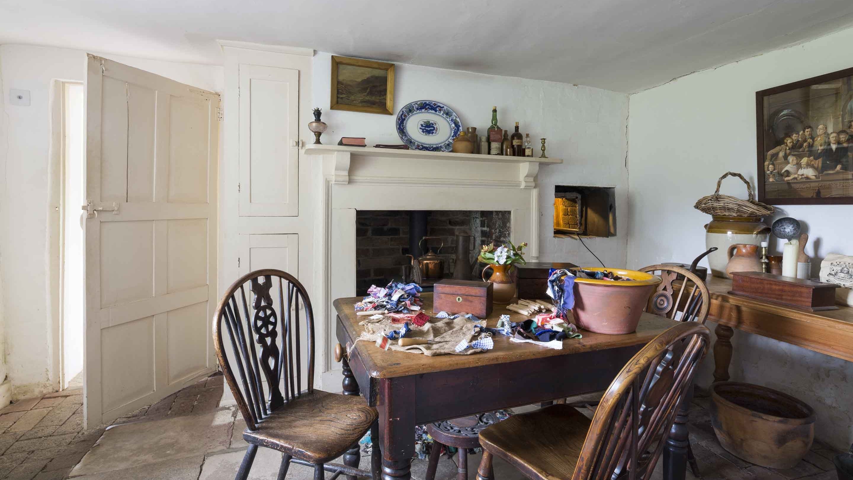 A view of a laden kitchen table inside Granny's Kitchen at Hardy's Cottage, Dorset