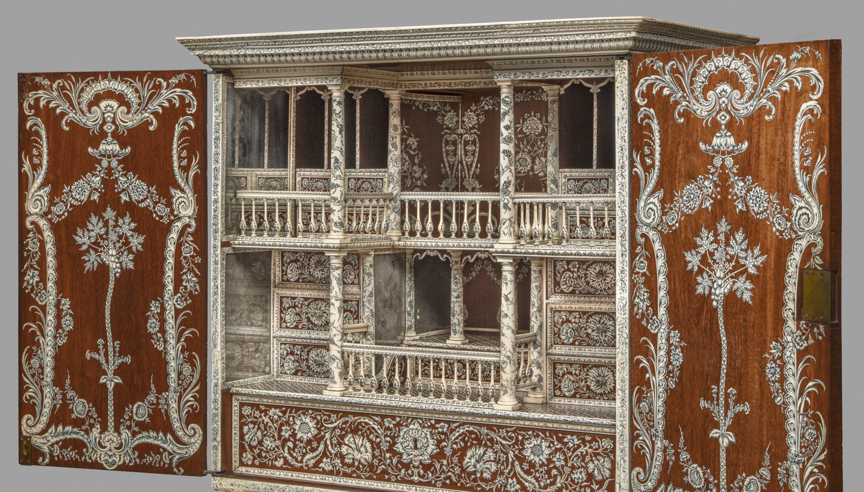 Eighteenth-century cabinet on a stand, made of wood and inlaid with ivory inlay