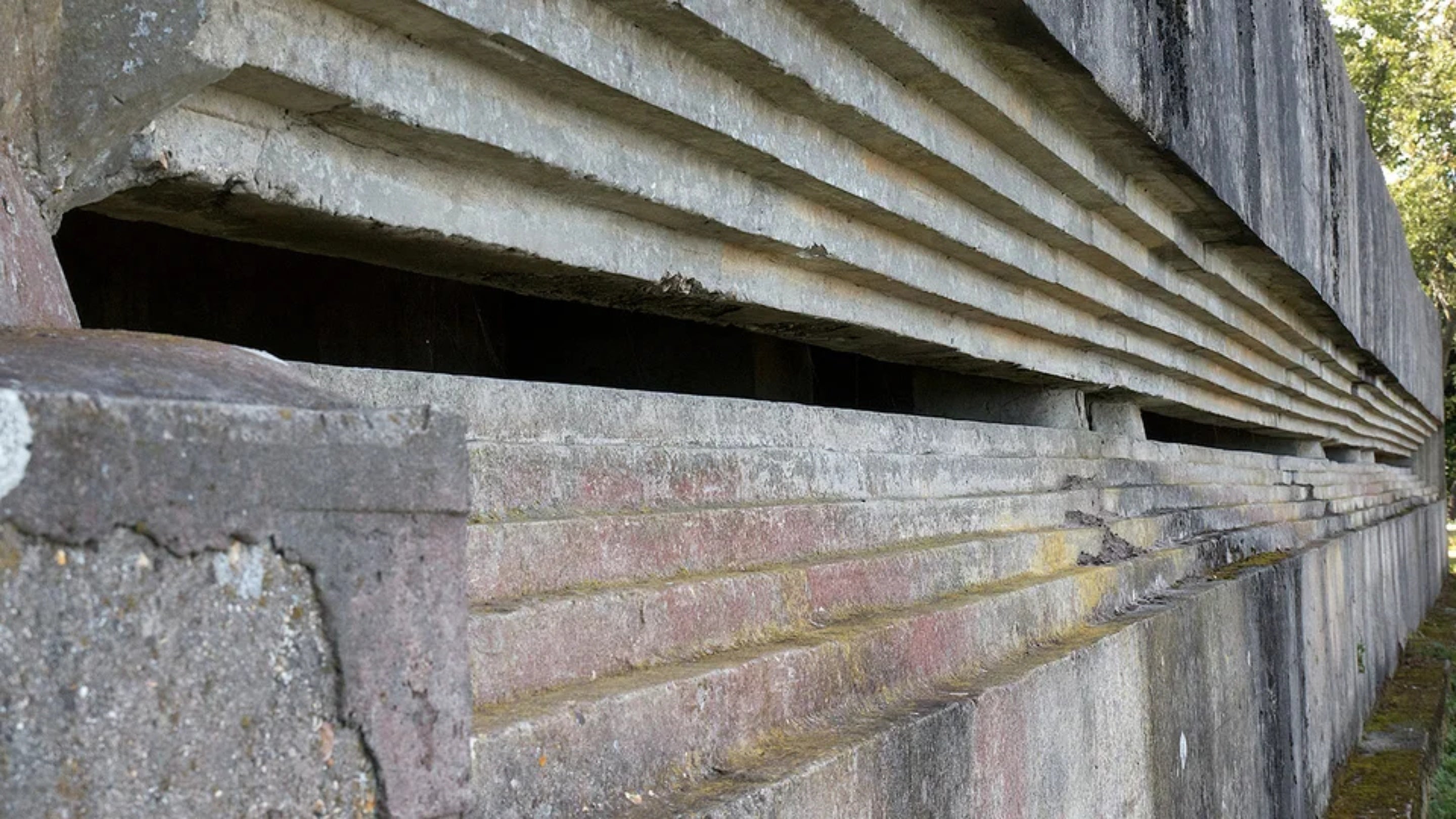 A long concrete building with a narrow horizontal slit for a window