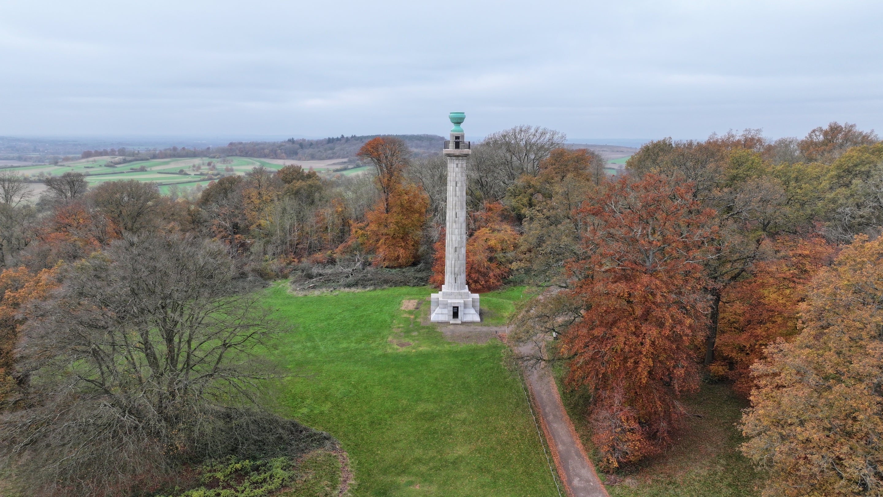 Surrounded by autumnal trees, Bridgewater Monument shows off its gleaming new façade.