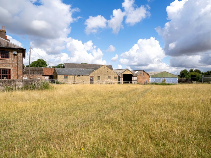A view toward the existing farm buildings at Ward's Hurst Farm