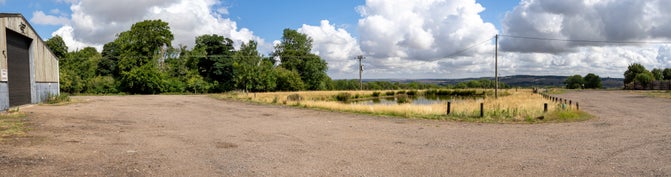 A panoramic view from Ward's Hurst Farm with pond in the foreground