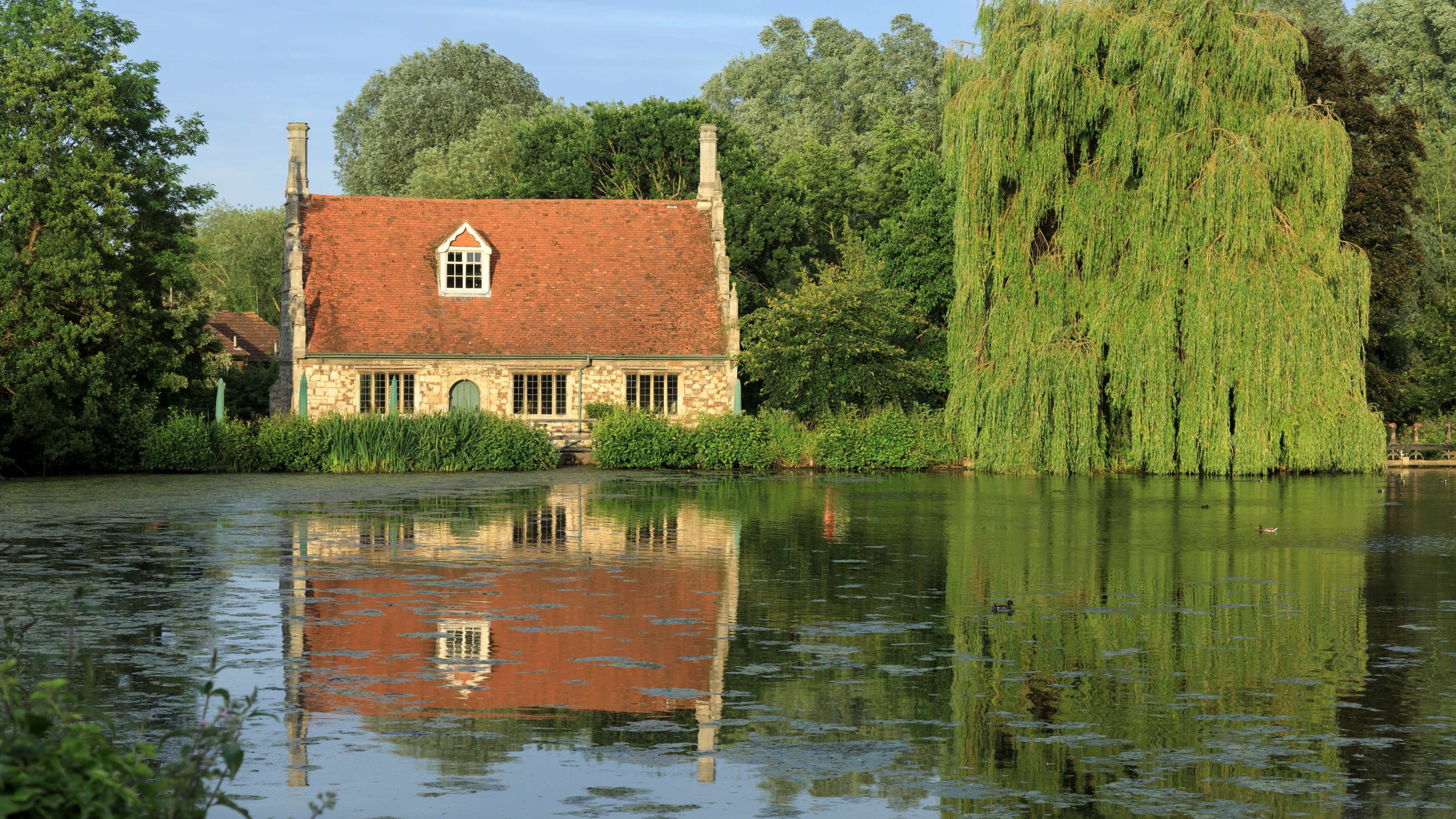 Image of old mill beside pond