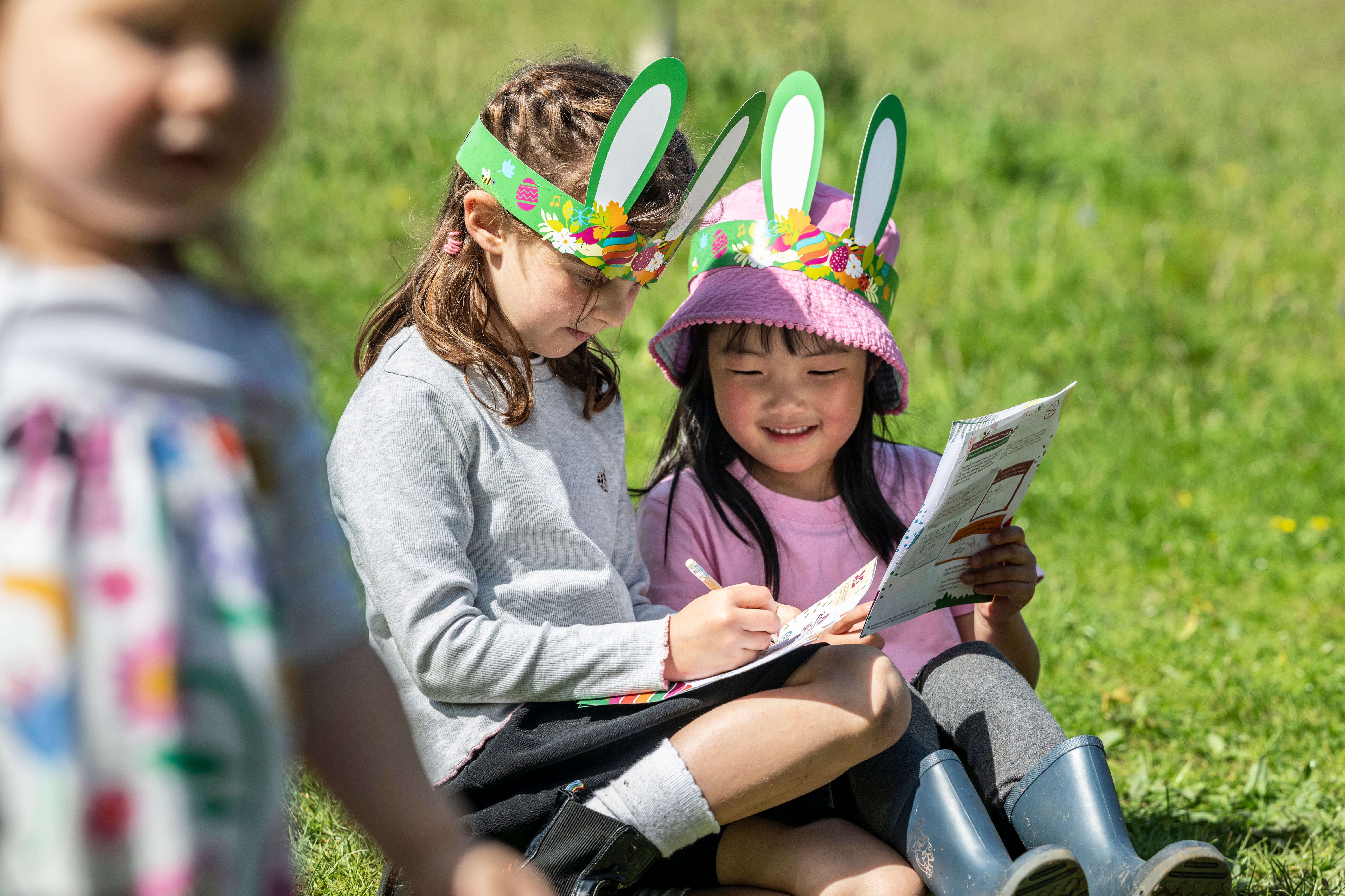 Families enjoying the activities along the Easter Adventure Trail at Plas yn Rhiw, Gwynedd