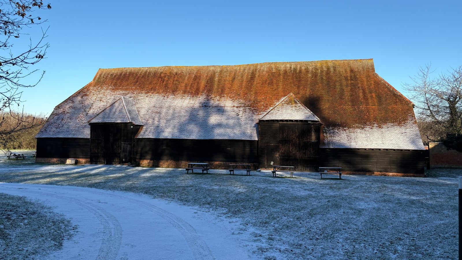 Grange Barn with light snow cover.