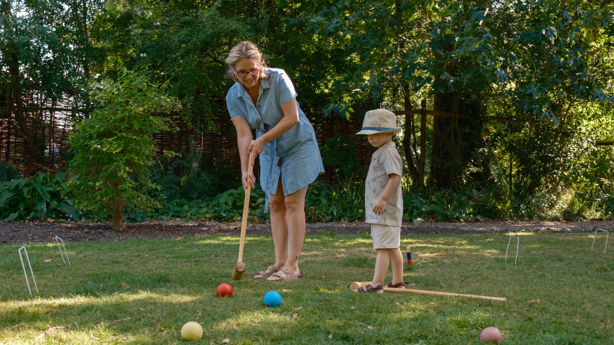 Woman and child playing croquet at Paycockes