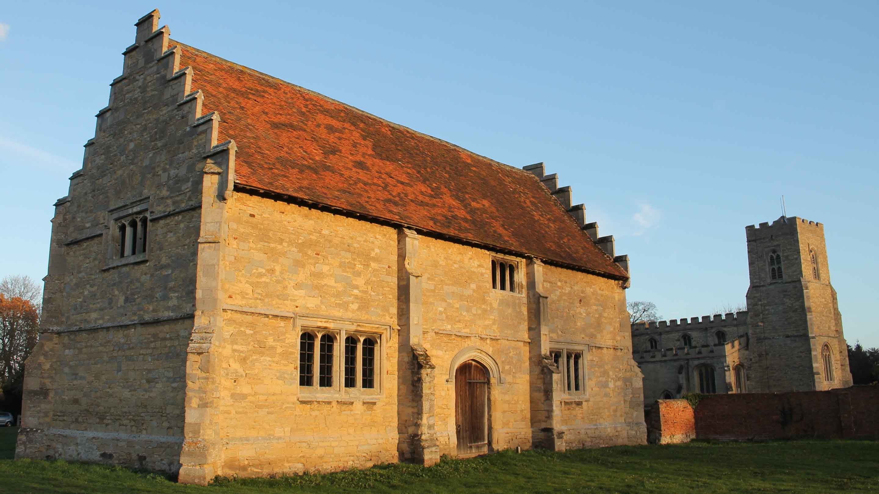 Close-up of the sunset-lit exterior of Willington Dovecote and stables, Bedfordshire