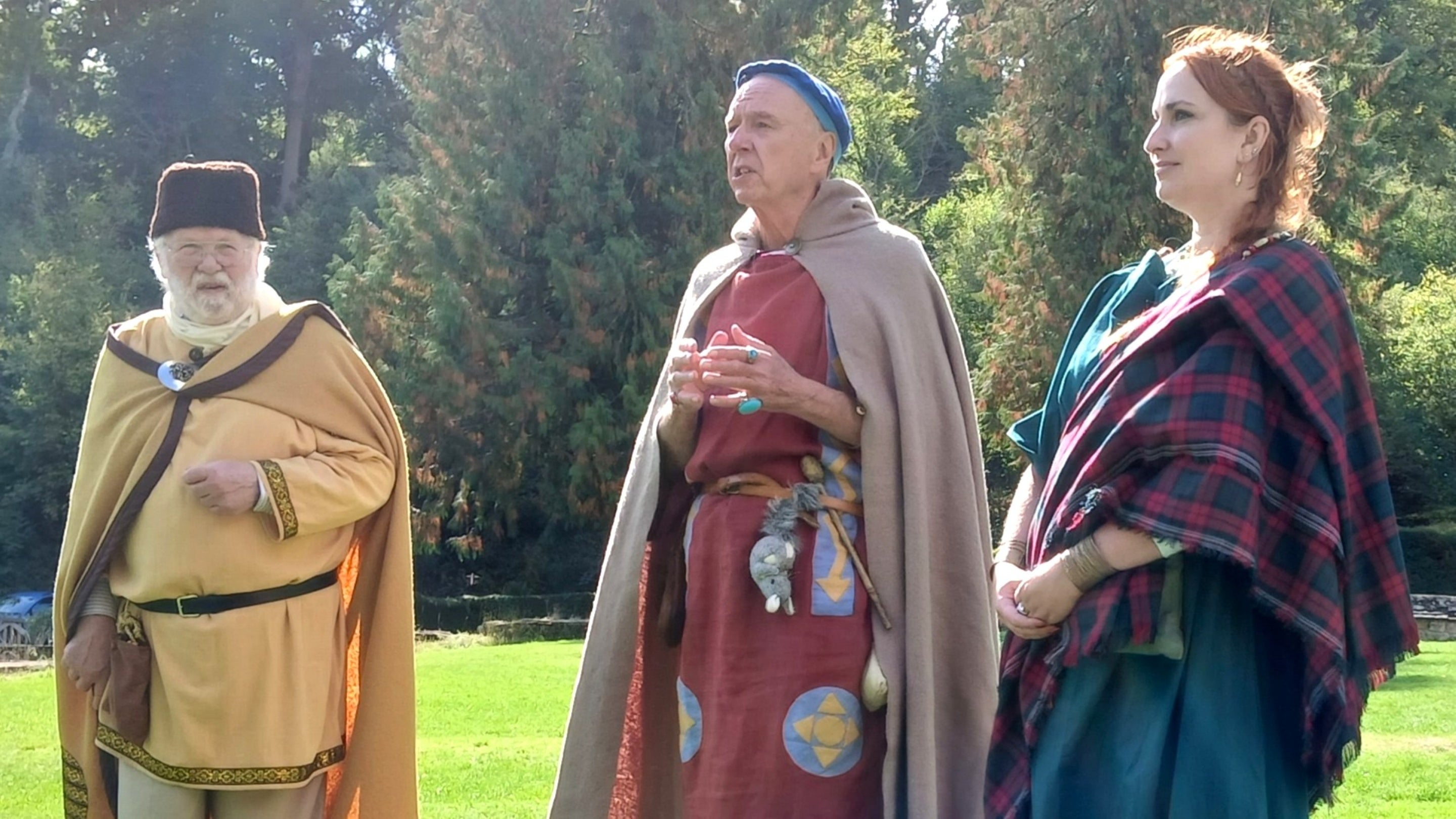 Three character actors dressed in Roman costume at Chedworth Roman Villa