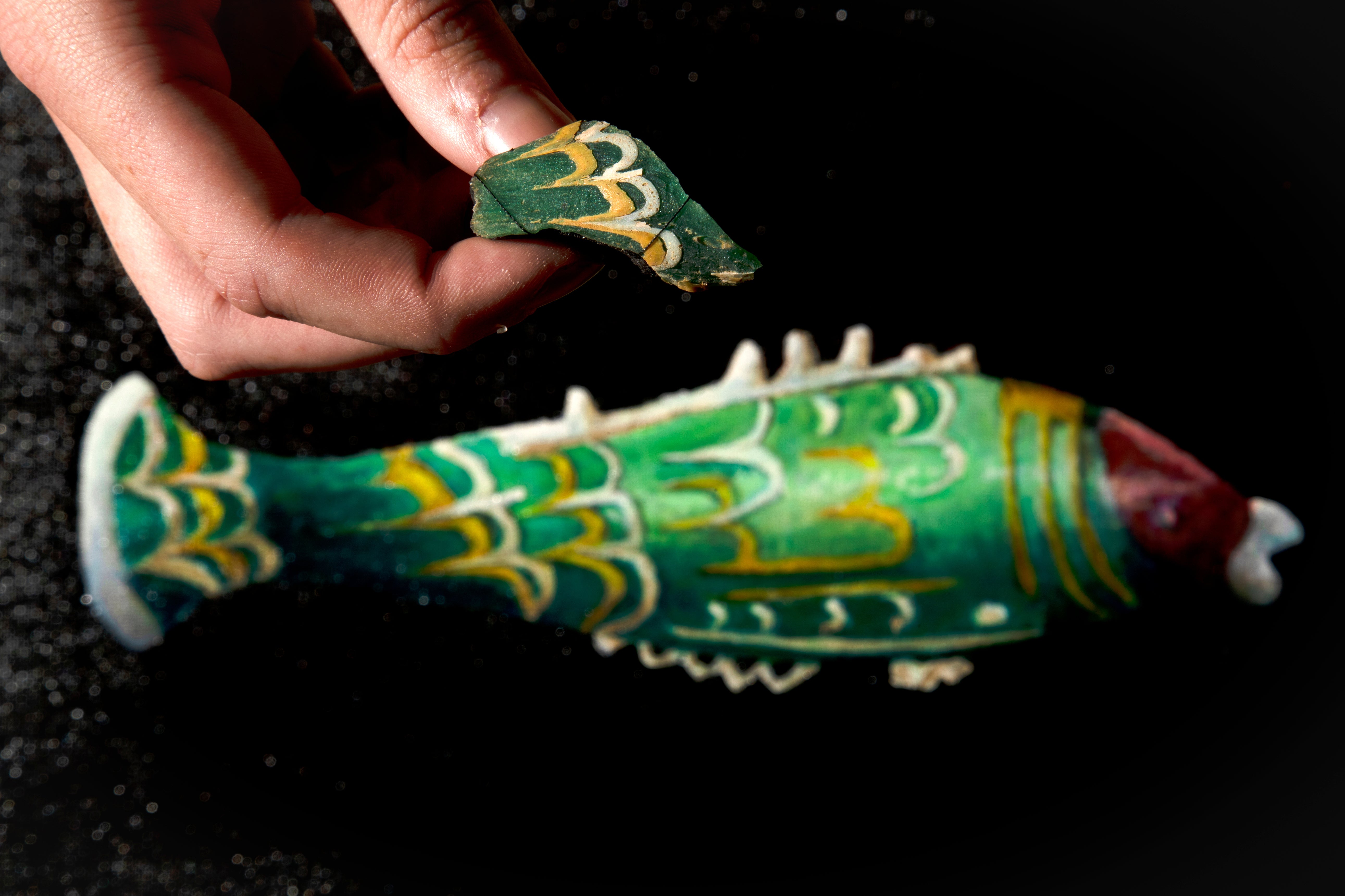 Fragment of glass from a fish shaped perfume bottle