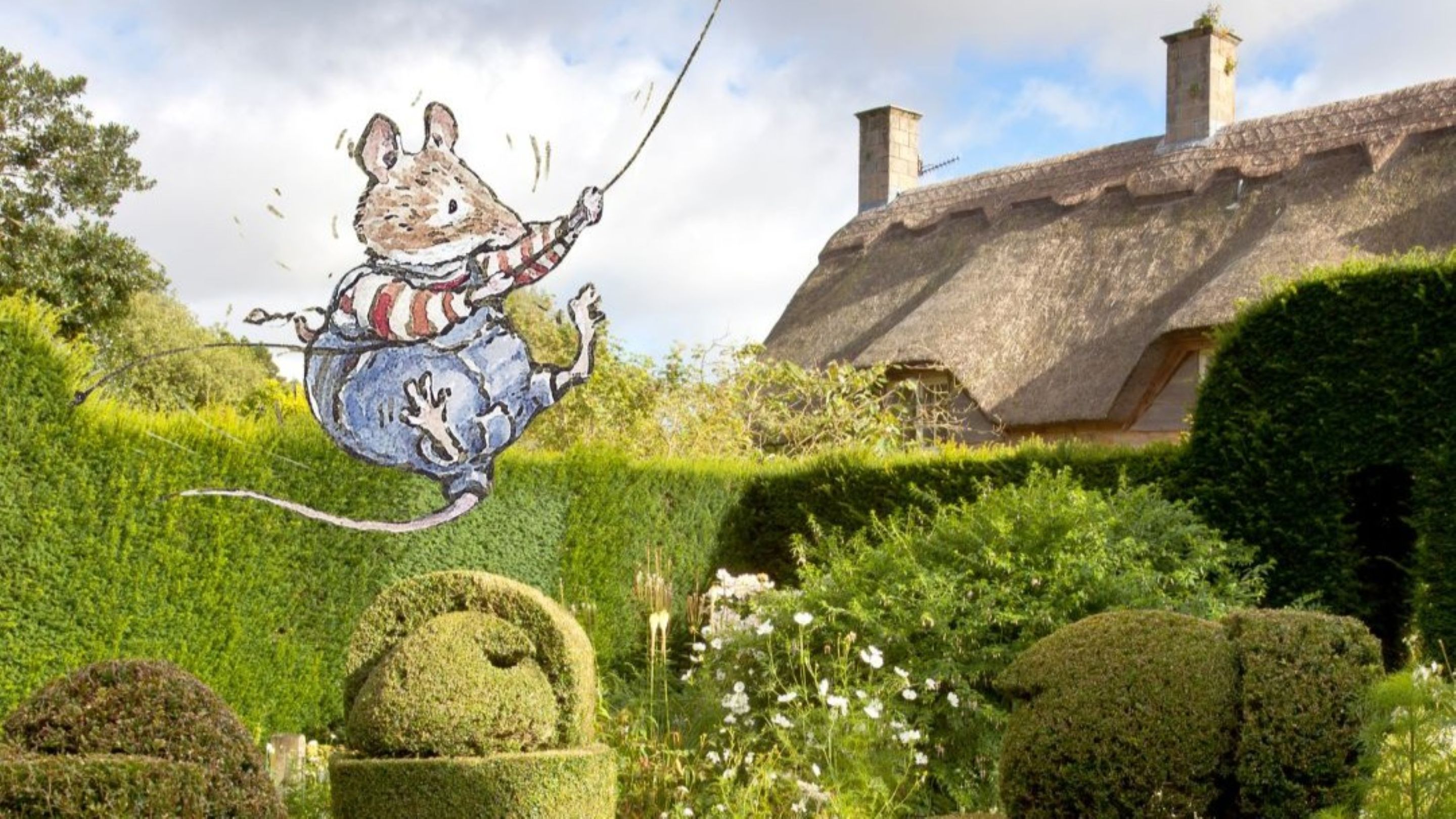 Image of mouse illustration over the top of an image of a garden