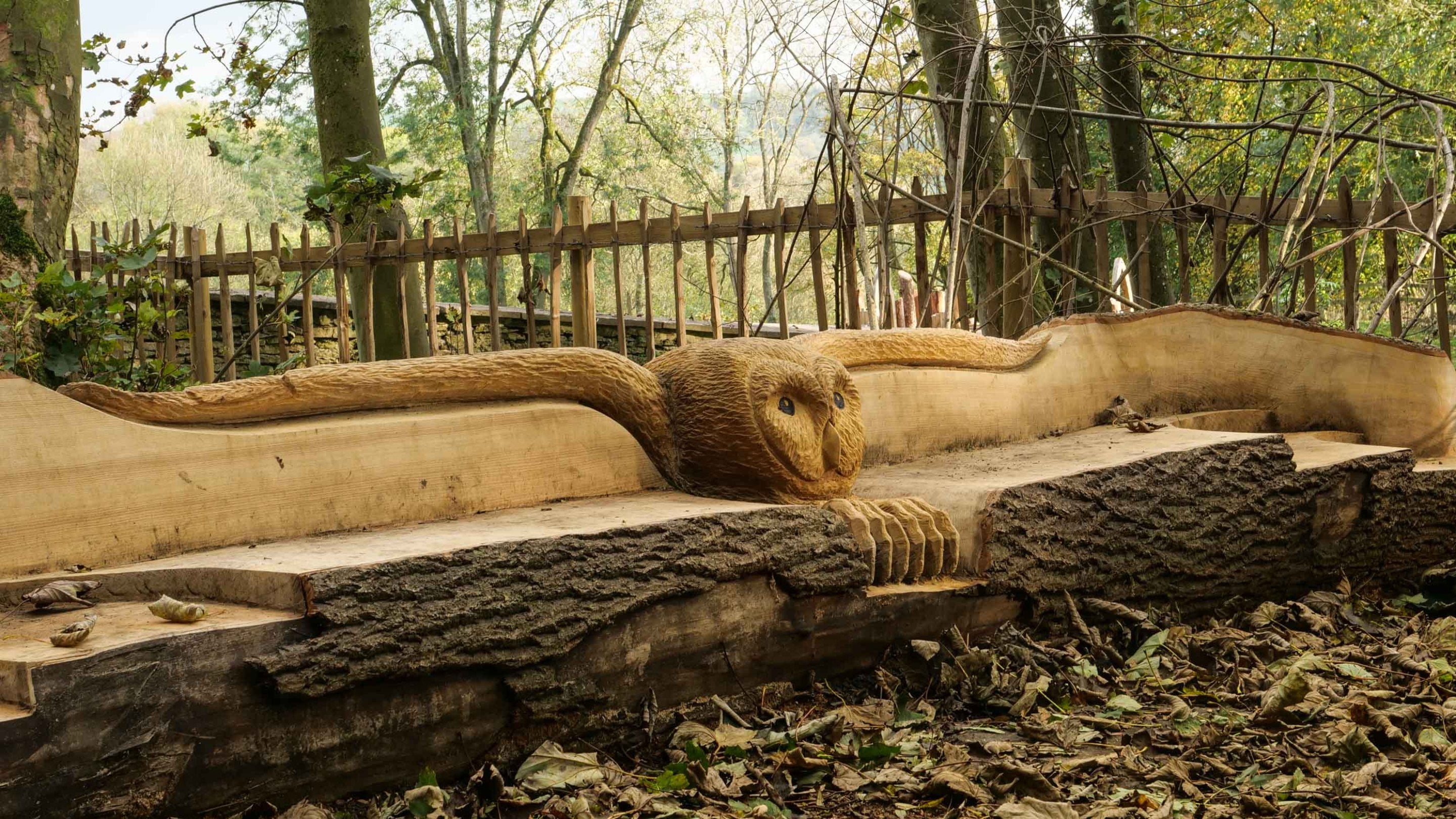 A sculpture of an owl carved into wood at Newark Park, Gloucestershire in winter