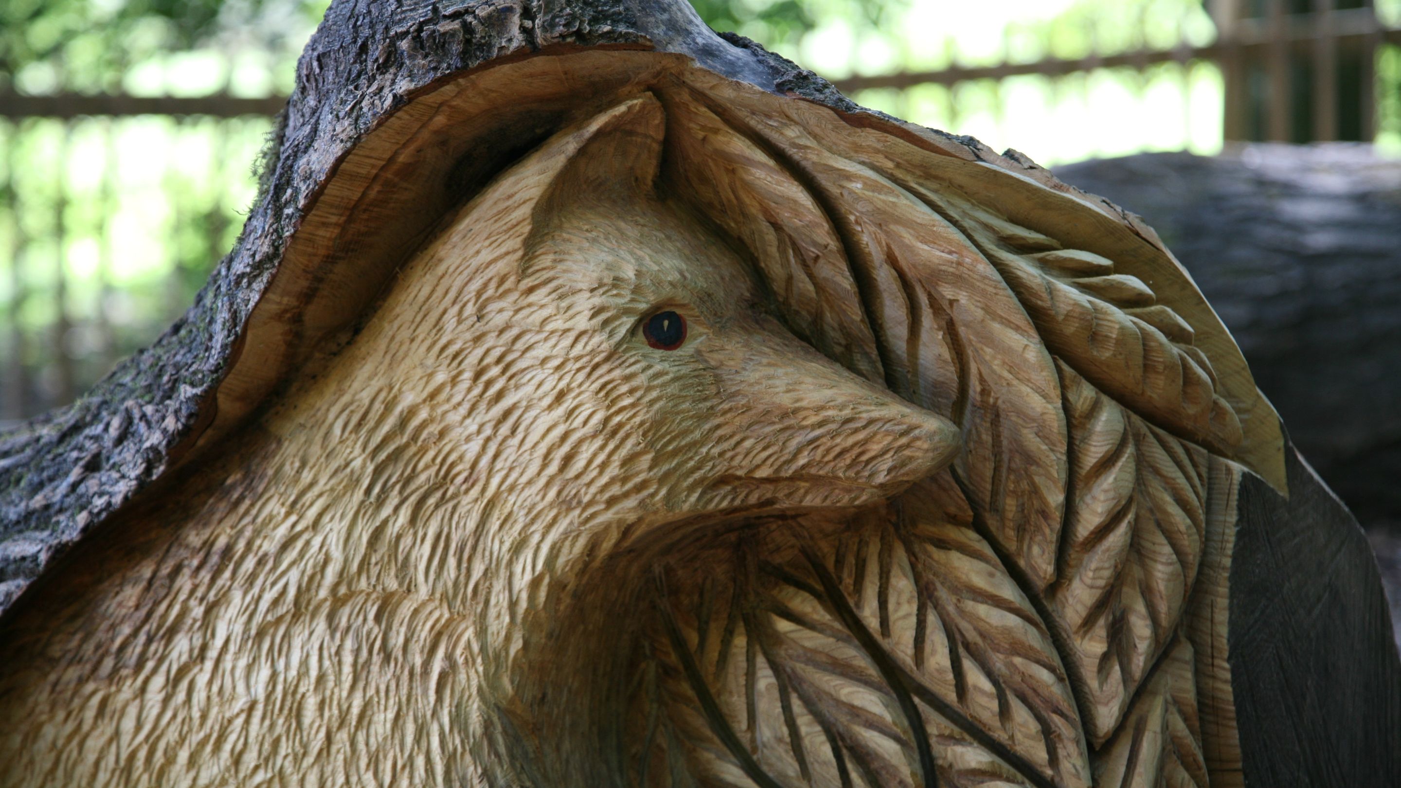 Wood carving of a fox in the play area at Newark Park, Gloucestershire