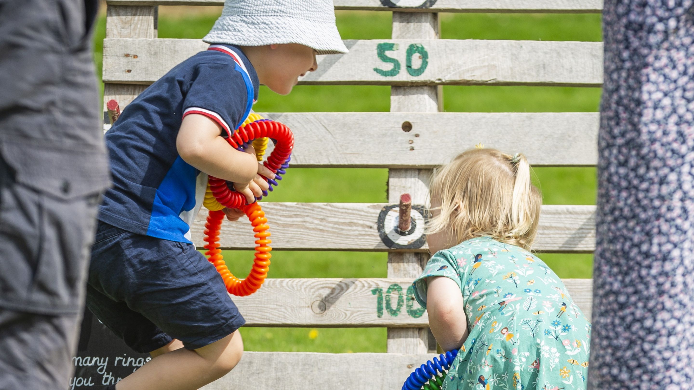 Two children playign quoits