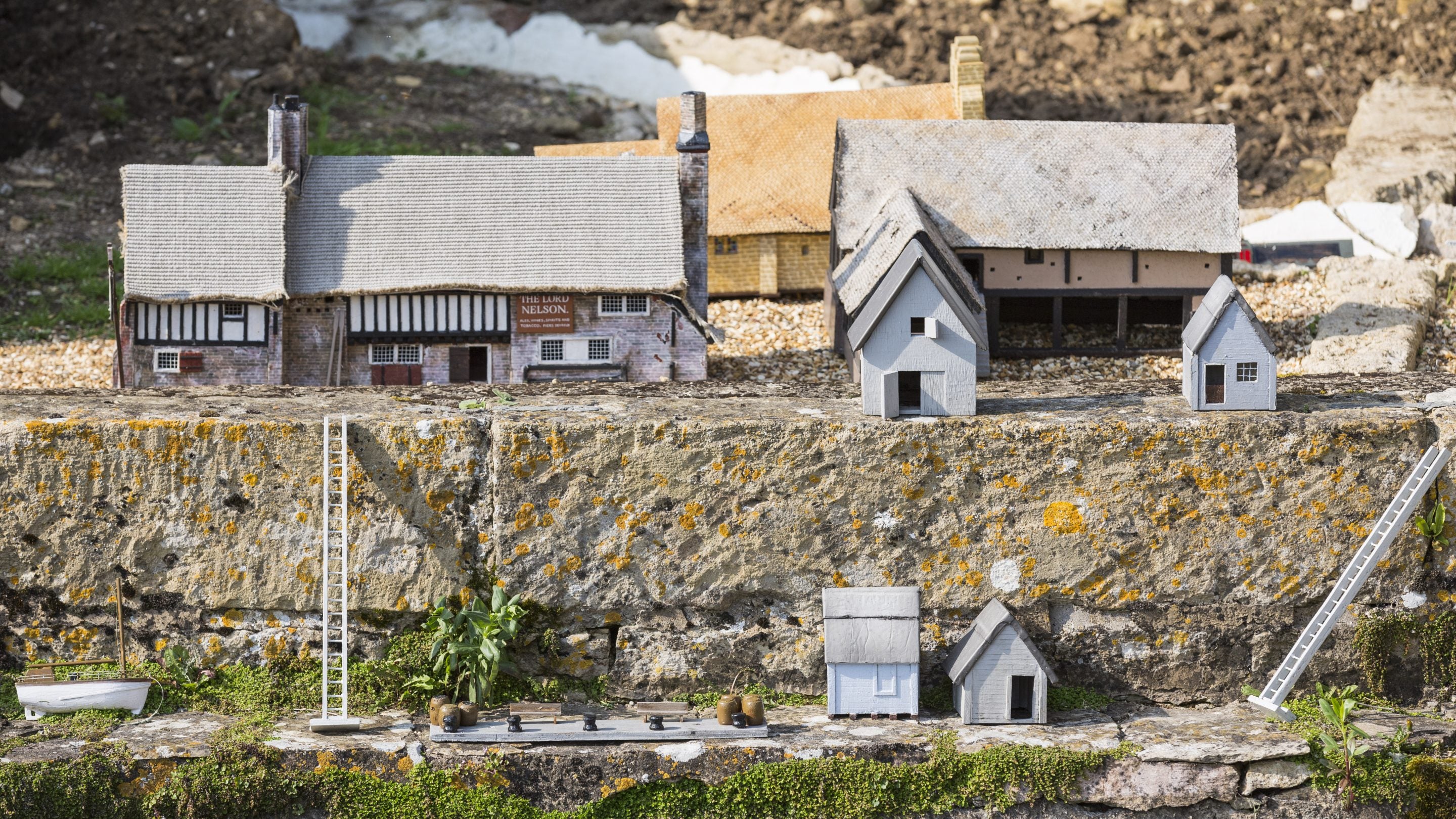 The houses and buildings in Wolf's Cove model village at Snowshill Manor and Garden, Gloucestershire