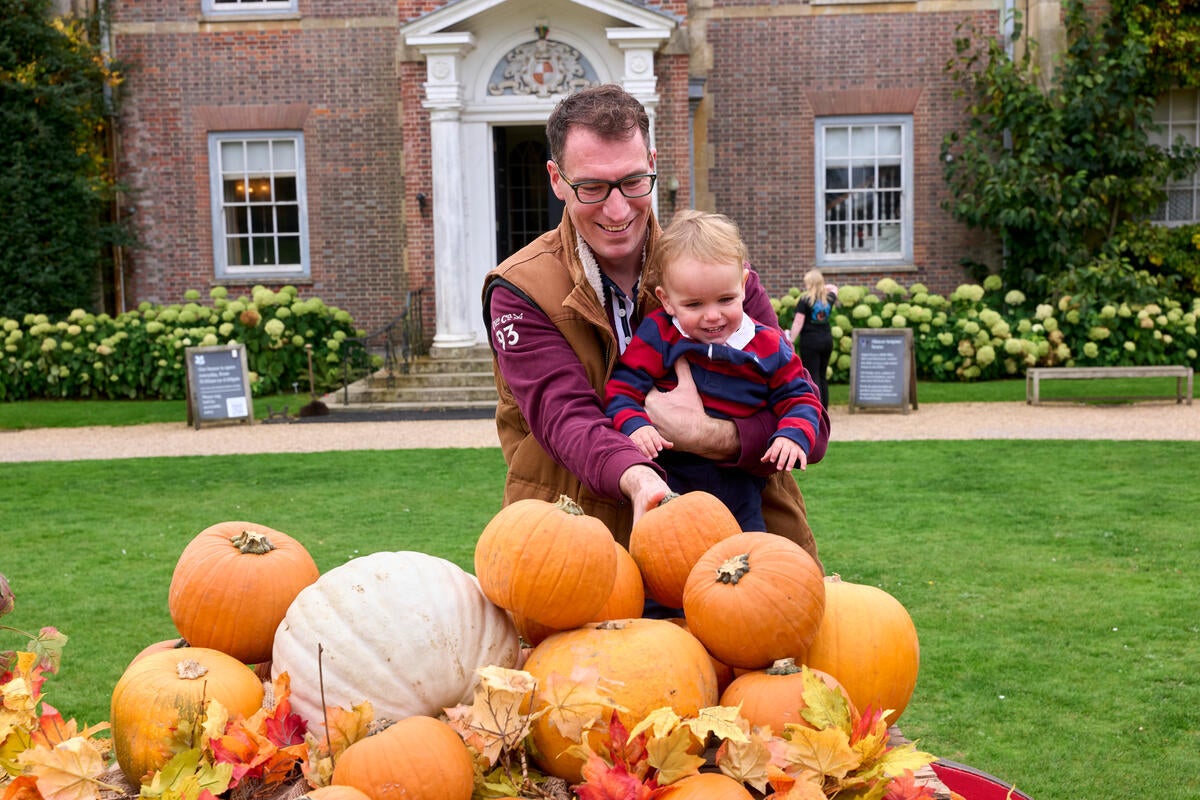 Family enjoying pumpkin displays at Hinton Ampner