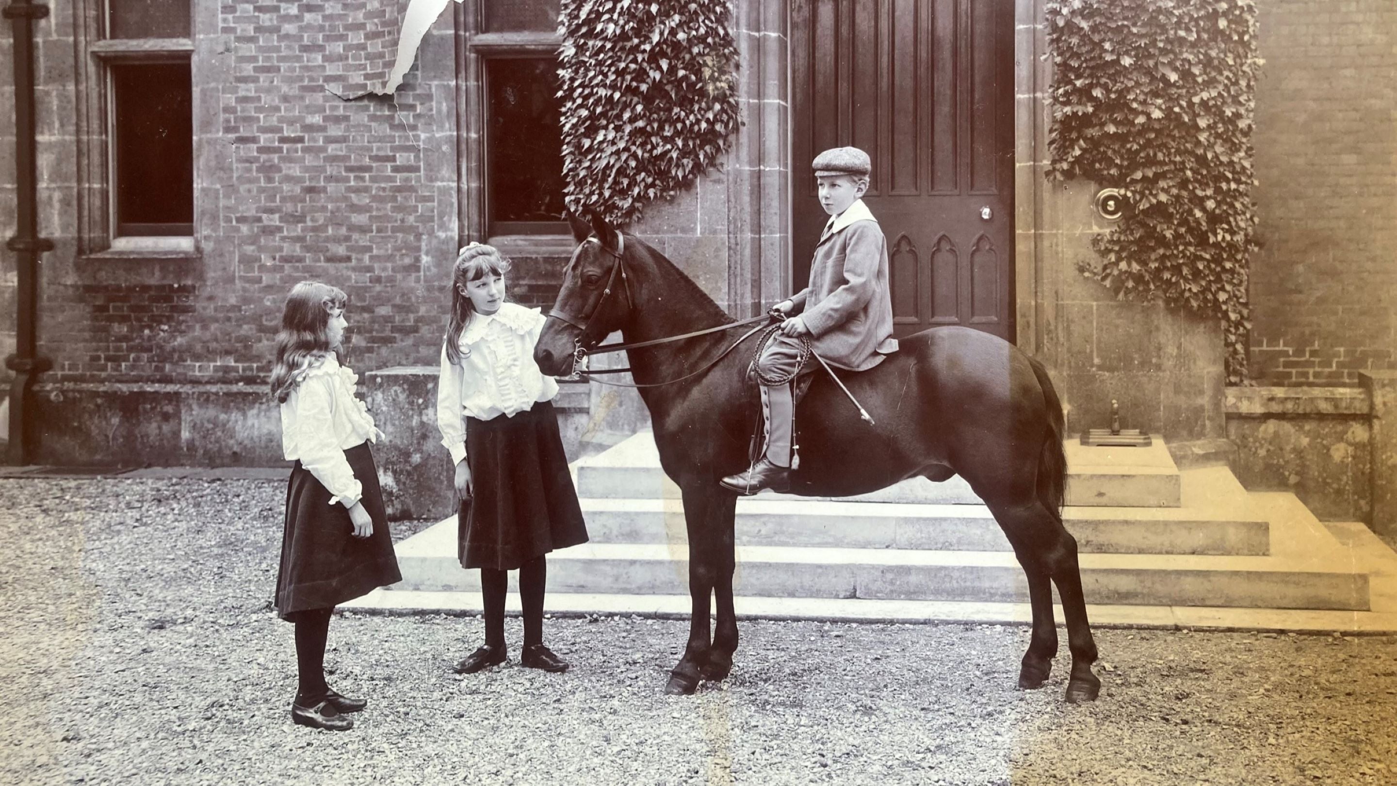 Ralph Dutton (on a horse) outside the front of Hinton Ampner, along with his sisters Blanche and Ursula in 1905