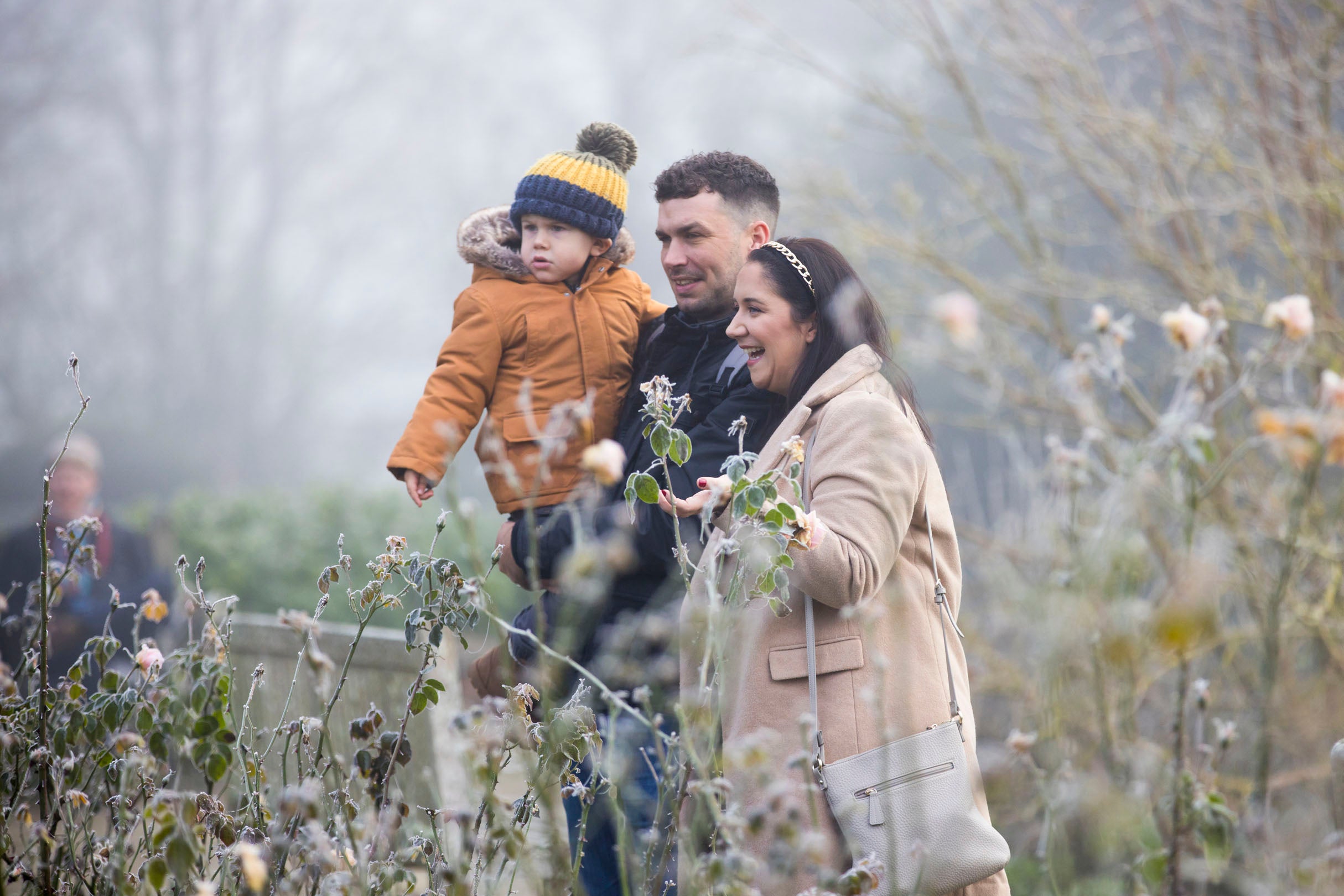A family exploring the gardens at Christmas at Hinton Ampner, Hampshire