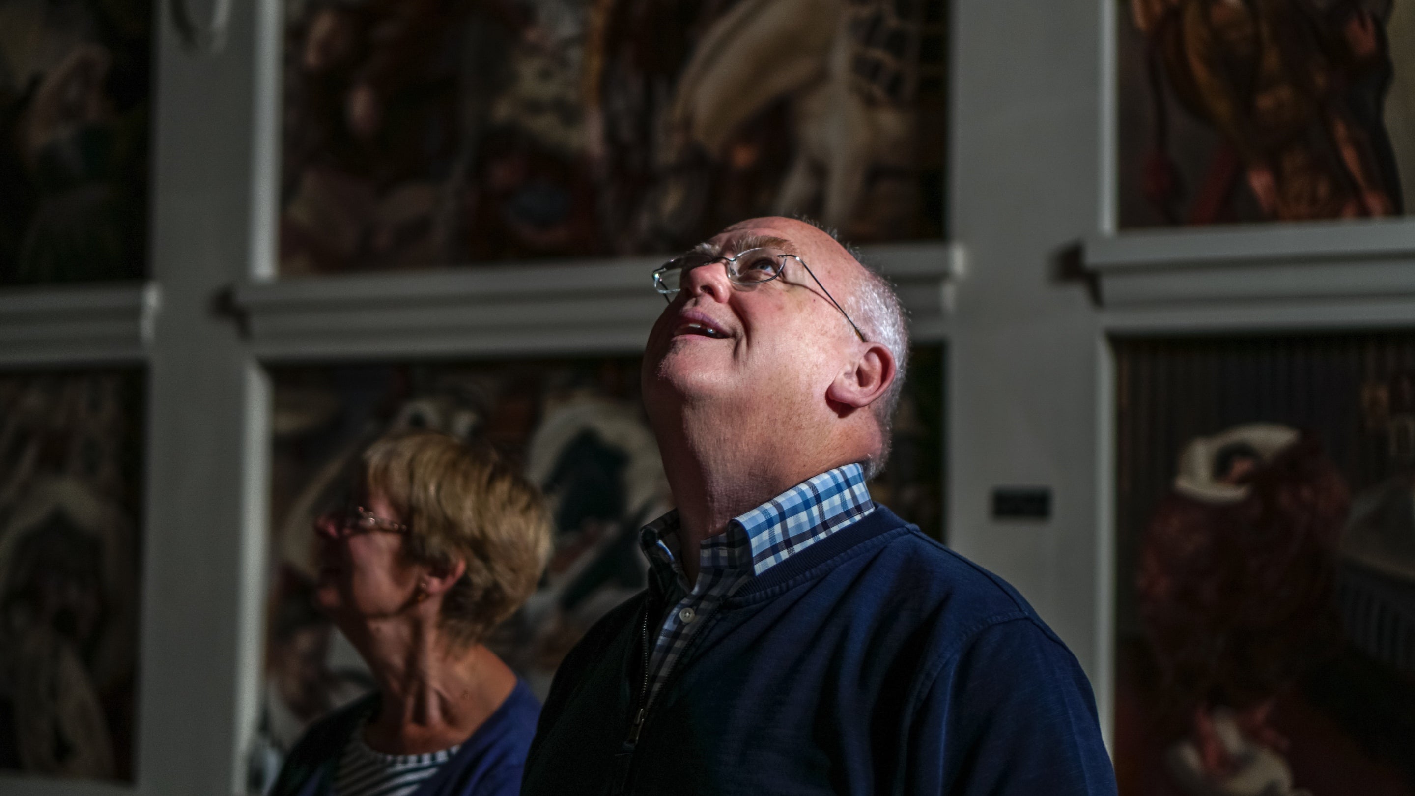 Visitors inside Sandham Memorial Chapel, Hampshire