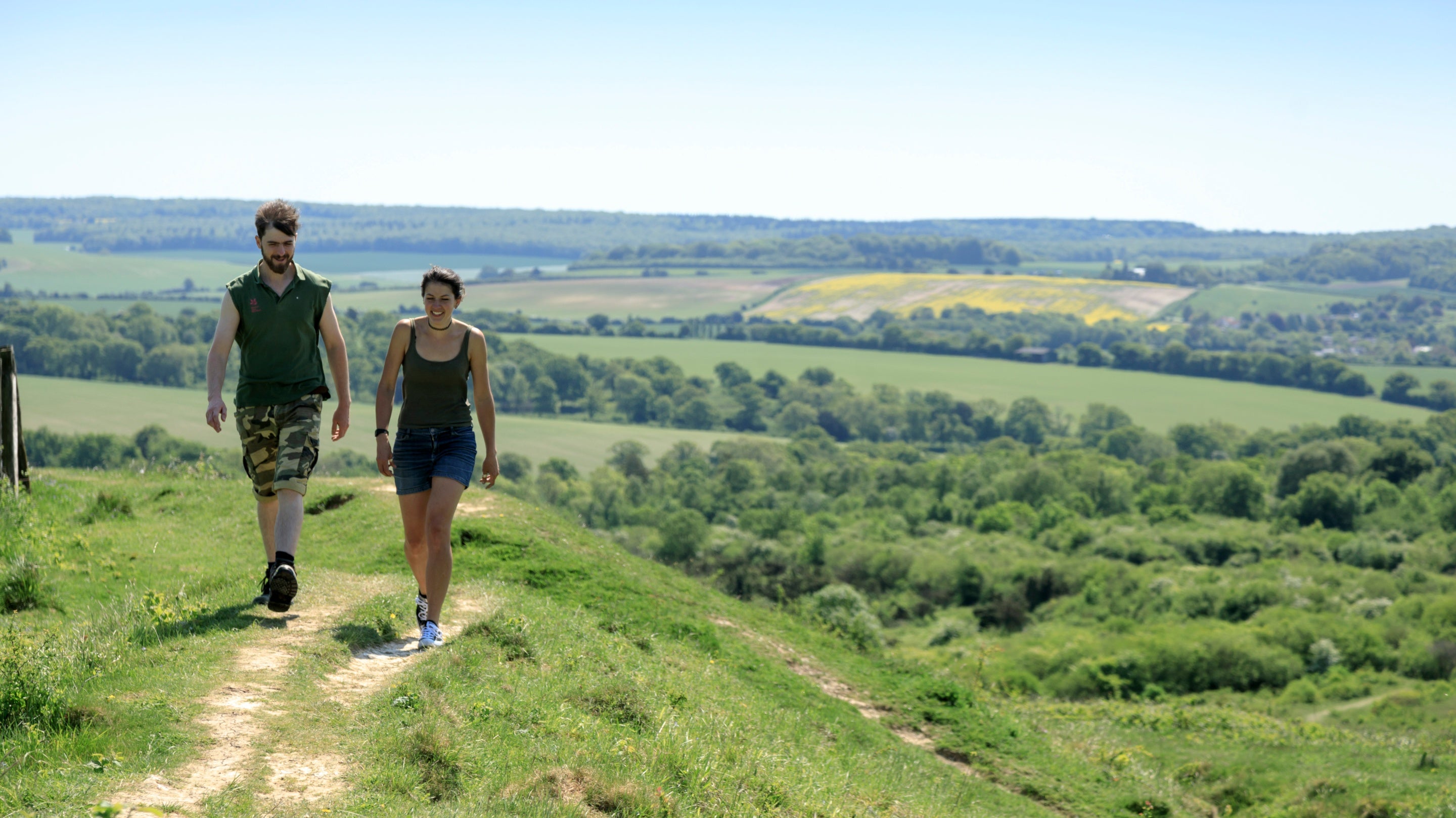 Two people walking at Stockbridge Down, Hampshire in the summer