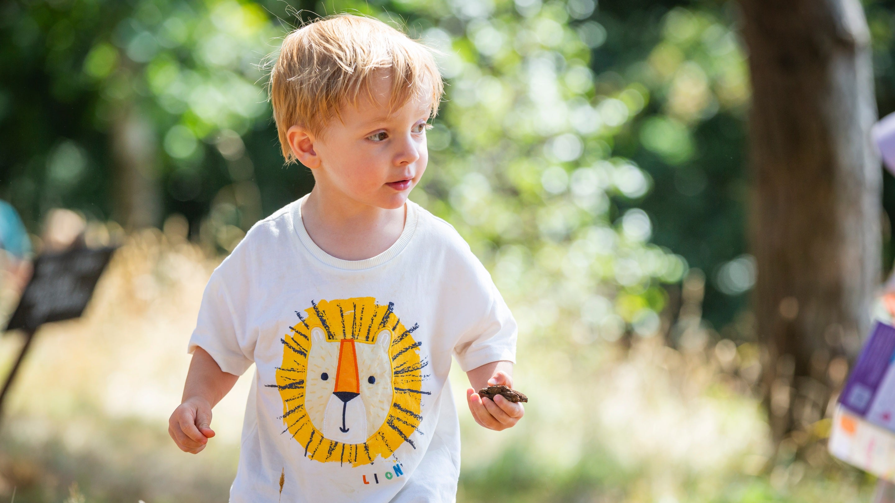A young child in a white t-shirt