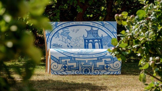 A bench in the shape of a book and specially decorated by an artist.