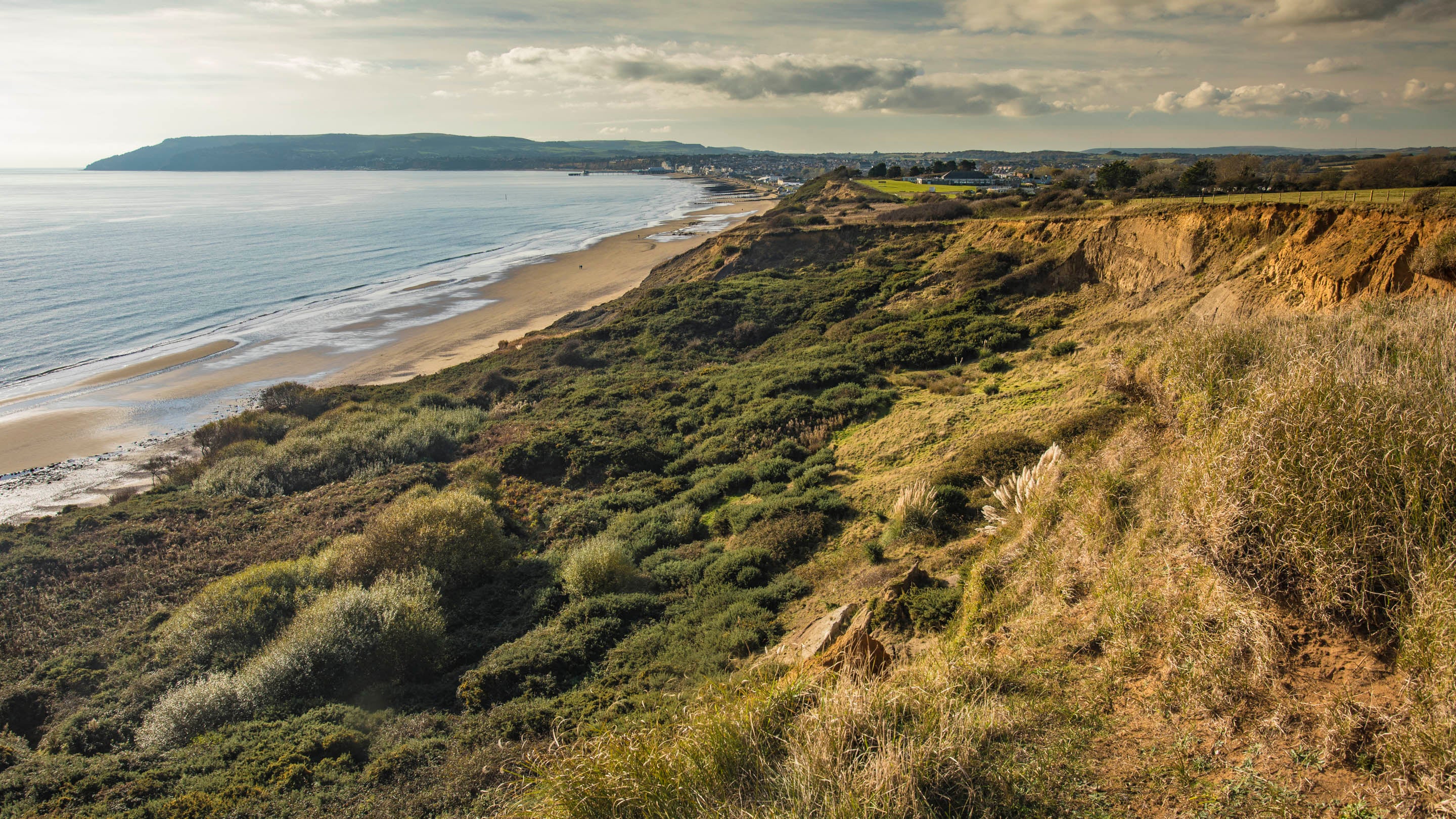 The landslip at Redcliff above sandy Yaverland beach on a calm autumn afternoon