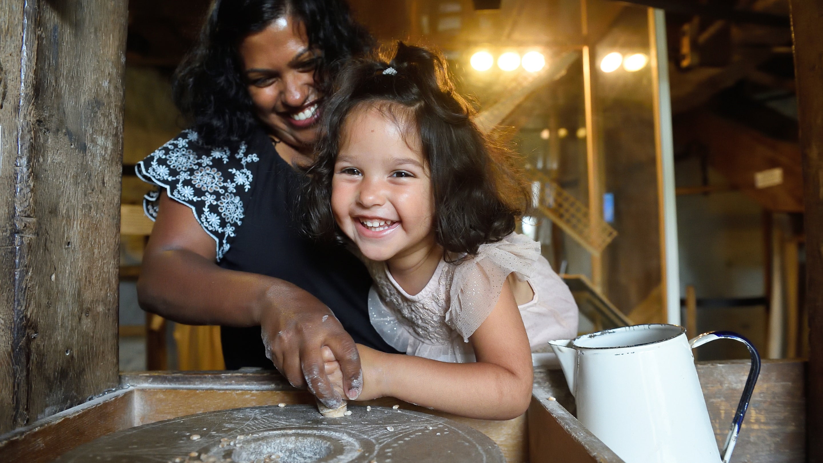 Family learning how flour is made at Bembridge Windmill, Isle of Wight