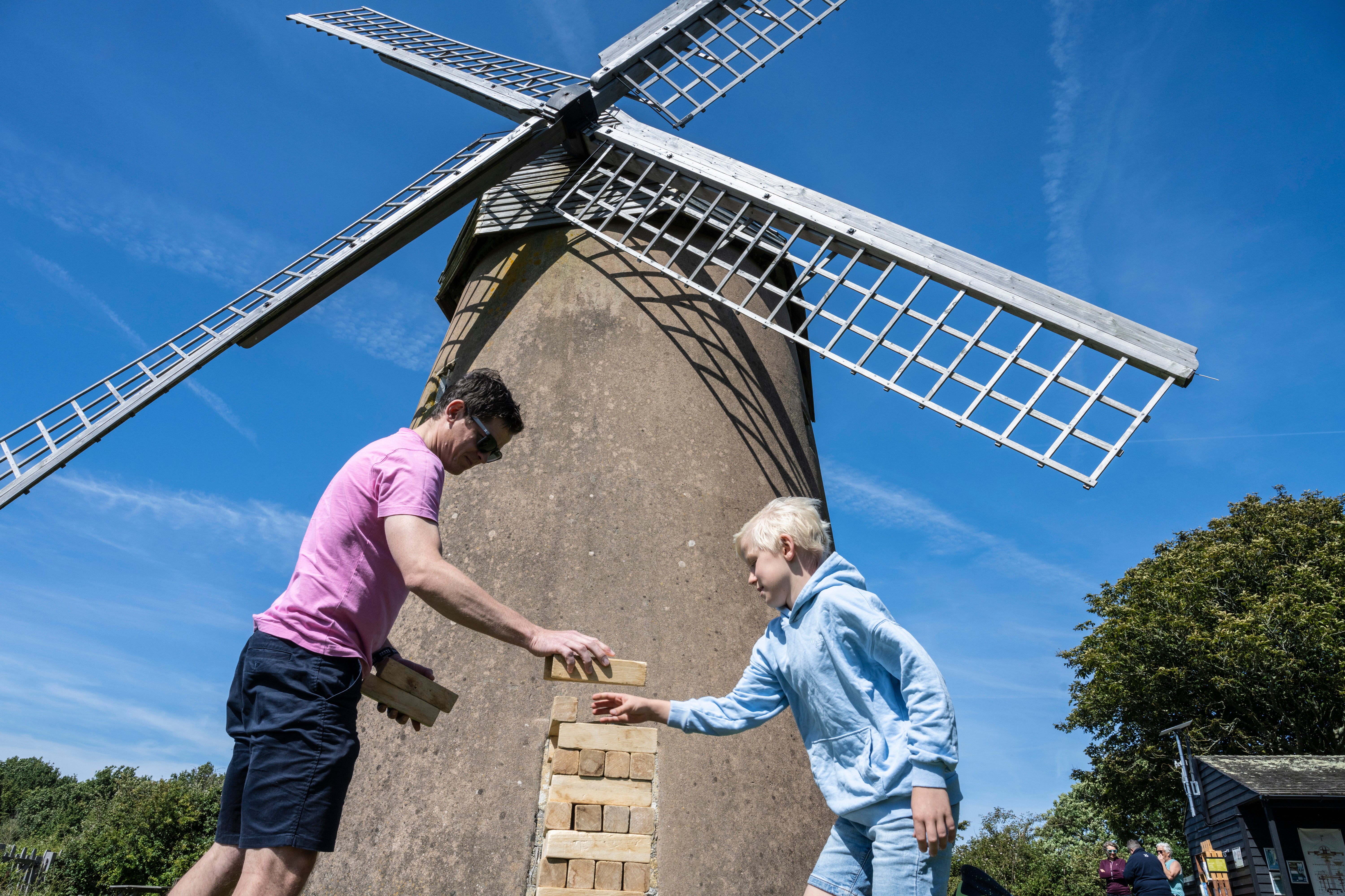 Family playing a block game at Bembridge Windmill