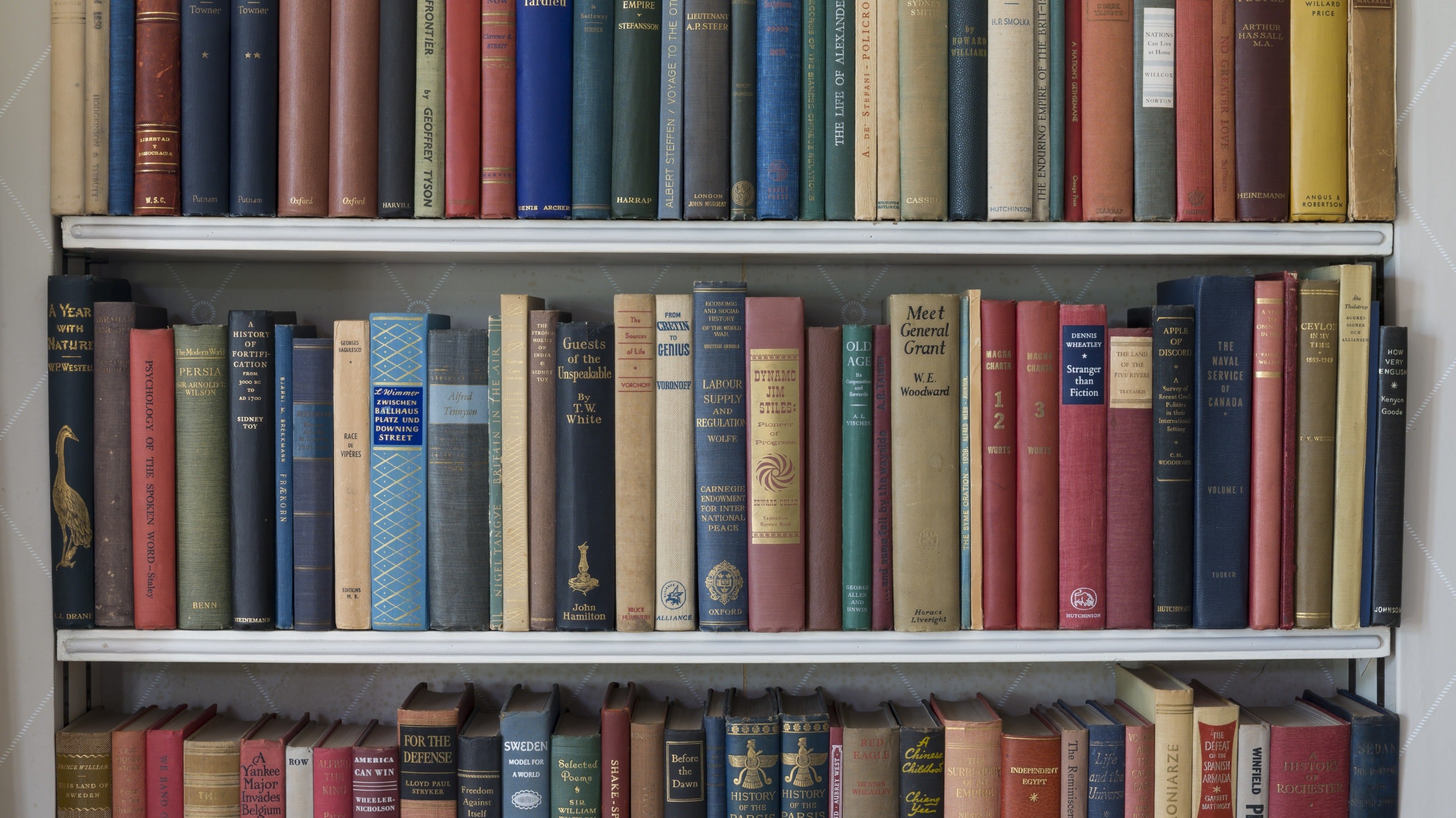Old books on the shelves in the Drawing Room at Chartwell, Kent