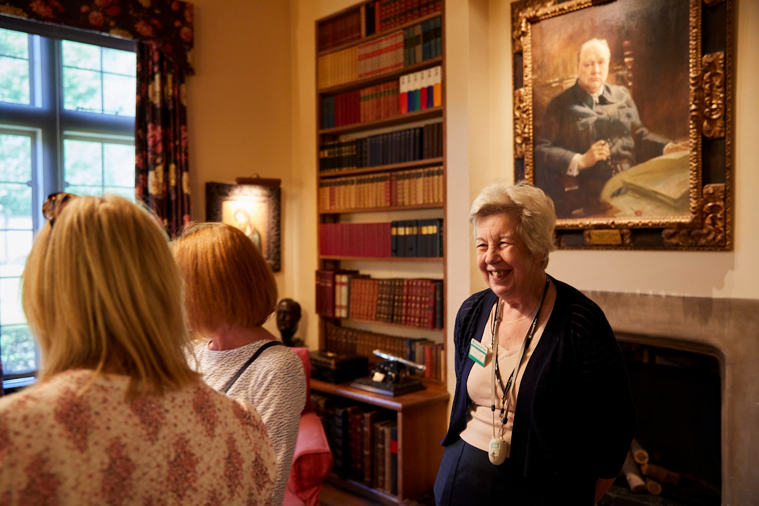 A volunteer room steward welcoming visitors to the house at Chartwell