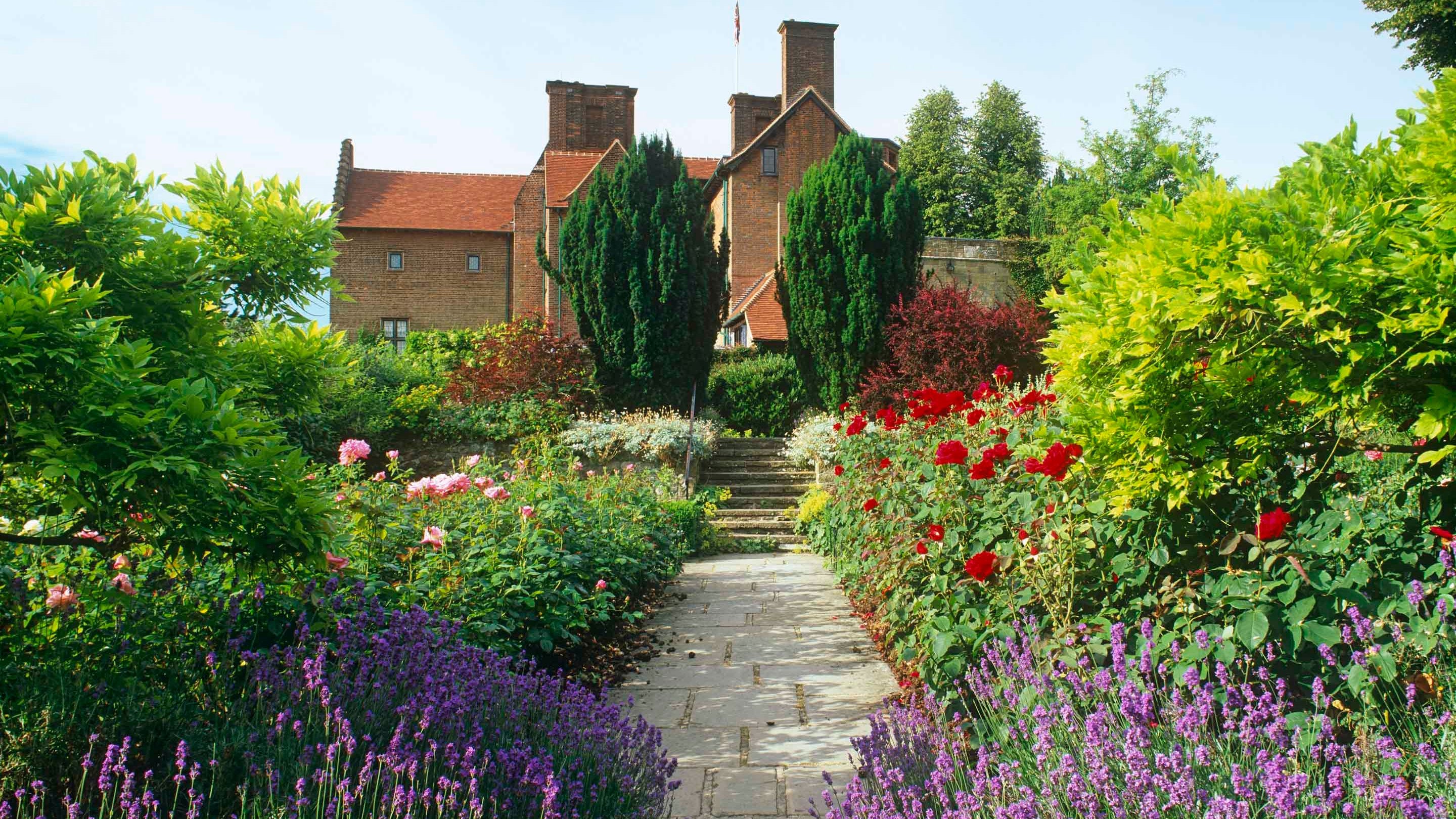 View of the house along a path in the Rose Garden