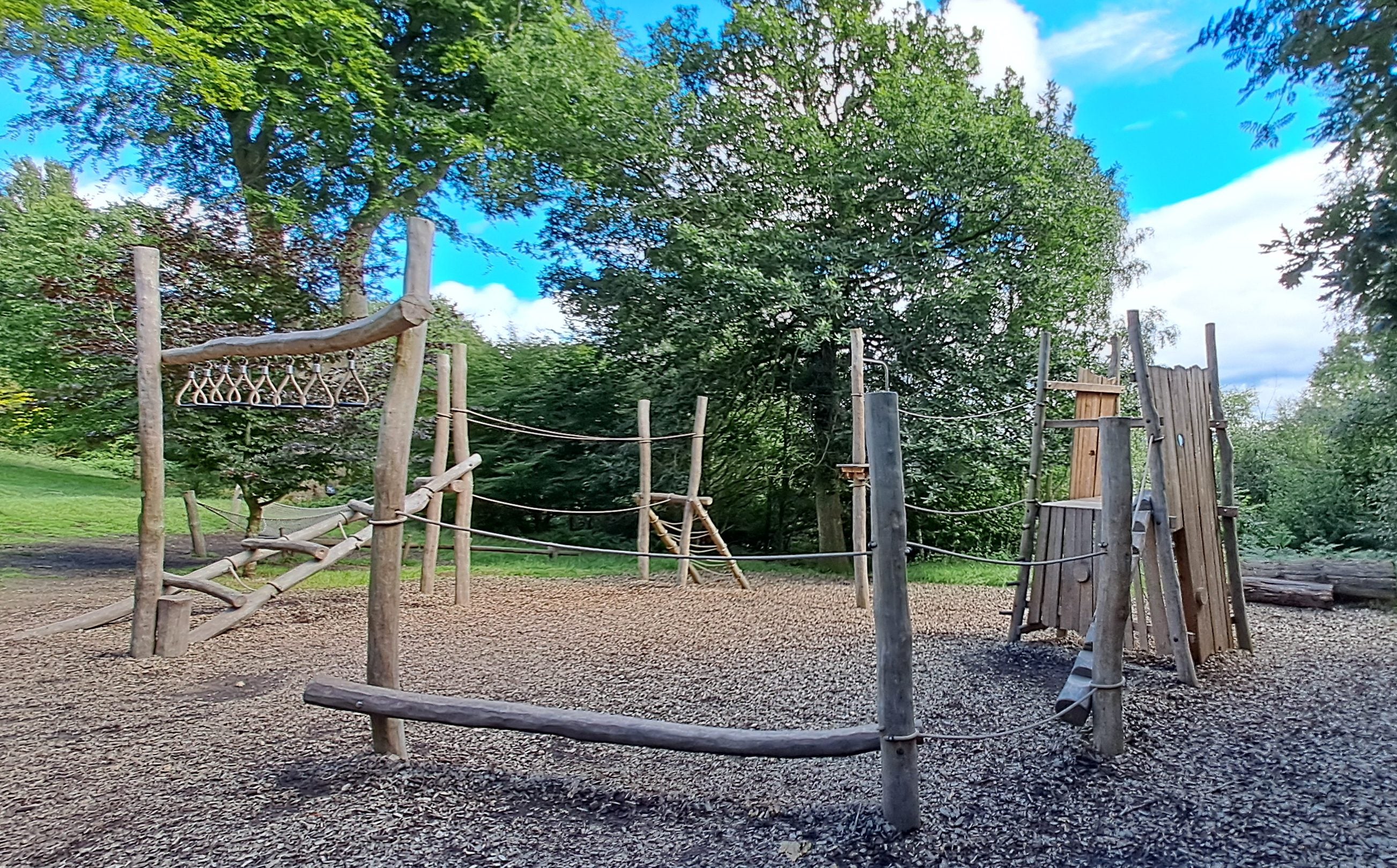 Wild play area wooden climbing frame at Emmetts Garden