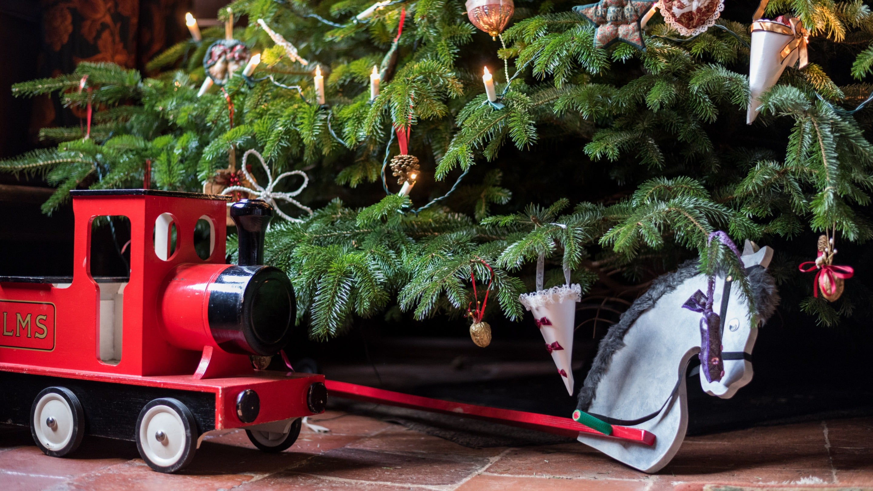 Christmas tree and toys in Great Hall, Ightham Mote, Kent