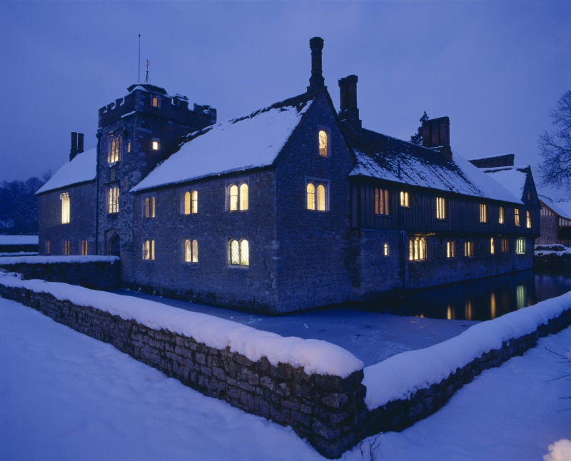 Ightham Mote after dark in the snow