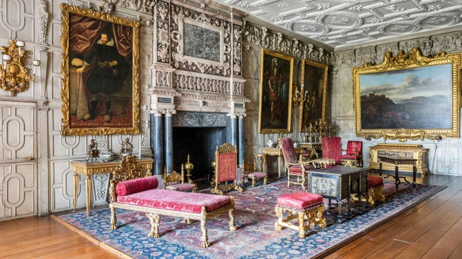 View of the Ballroom at Knole, Kent. Decorative chimneypiece and plasterwork ceiling, by Richard Dungan.
