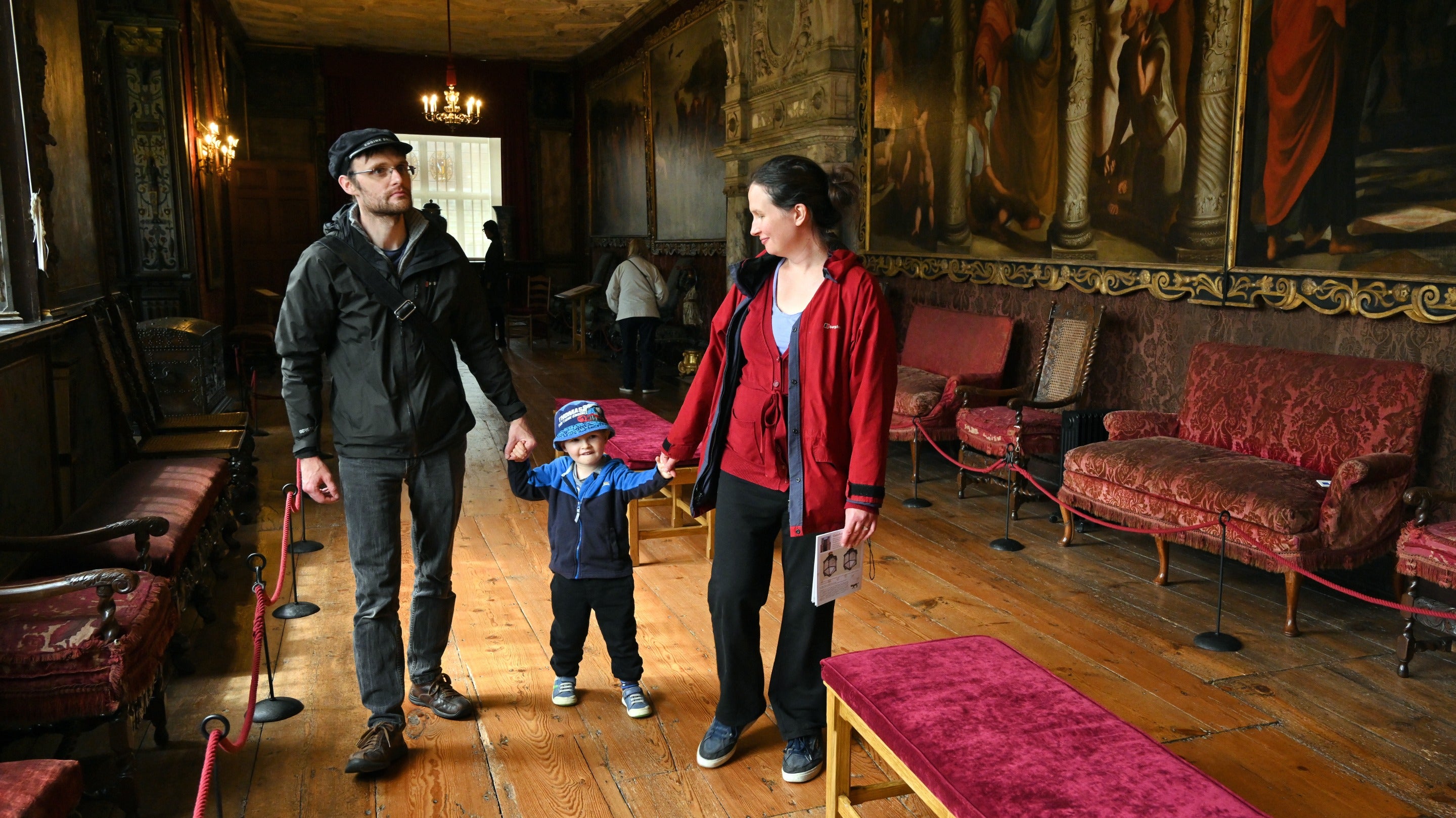 Family visiting the Cartoon Gallery at Knole, Kent