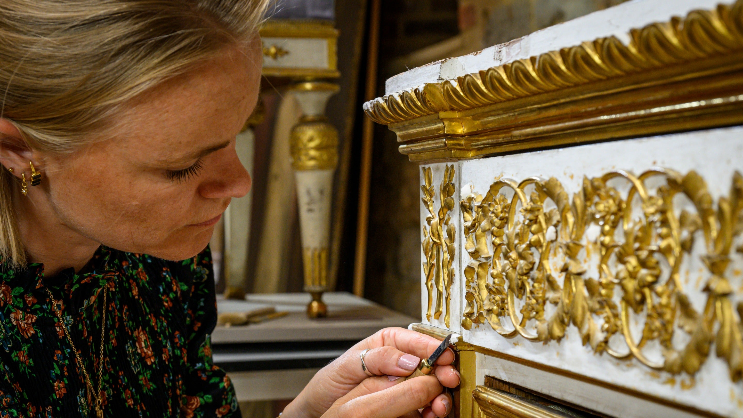 A conservator works on a royal Sardinian chest from Attingham Park, Shropshire