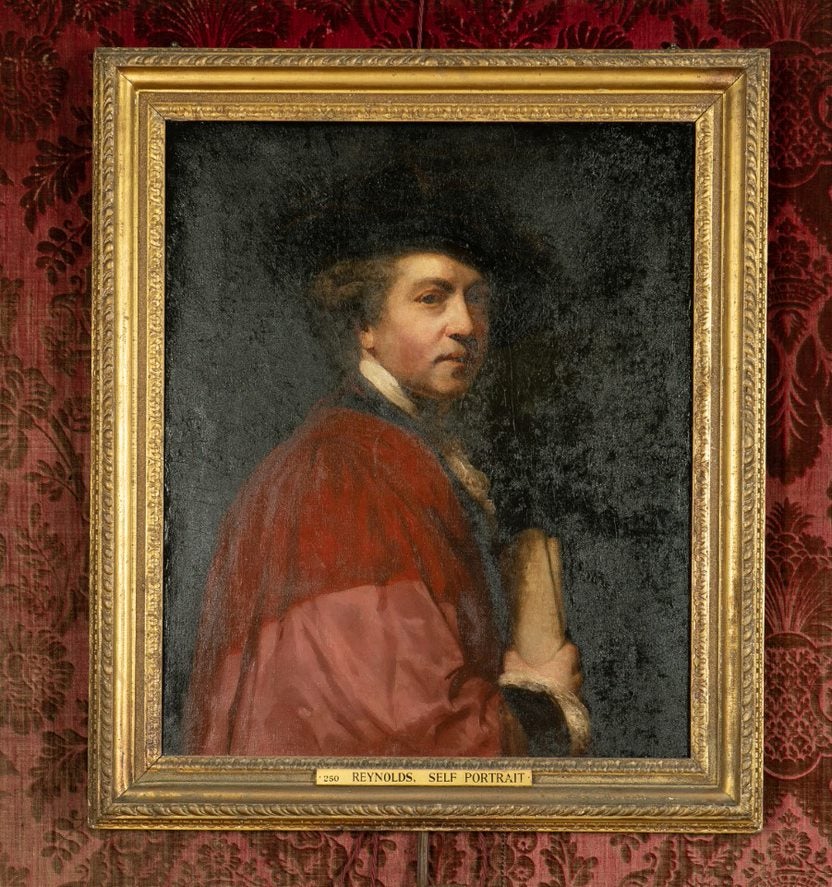 Painted portrait of a man in a gold coloured frame