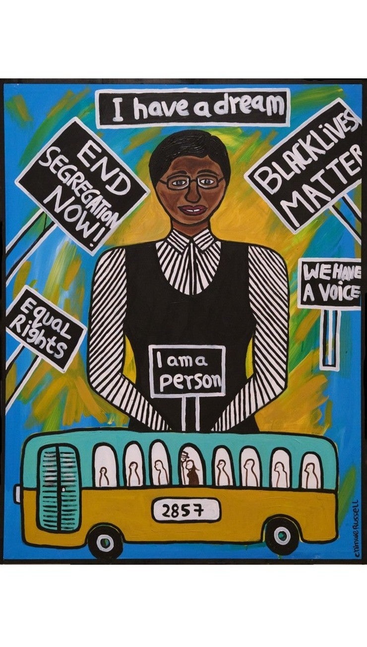A painting of a women in a black dress on a blue and yellow background standing behind a bus. She is holding a sign that says I am a person. There are other signs on the painting around her.