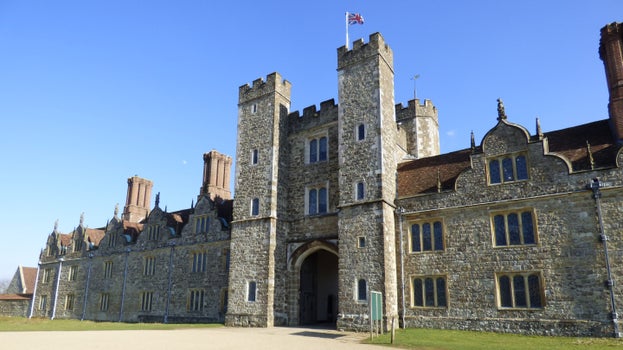 West Front exterior of Knole House on a bright sunny day with blue sky.