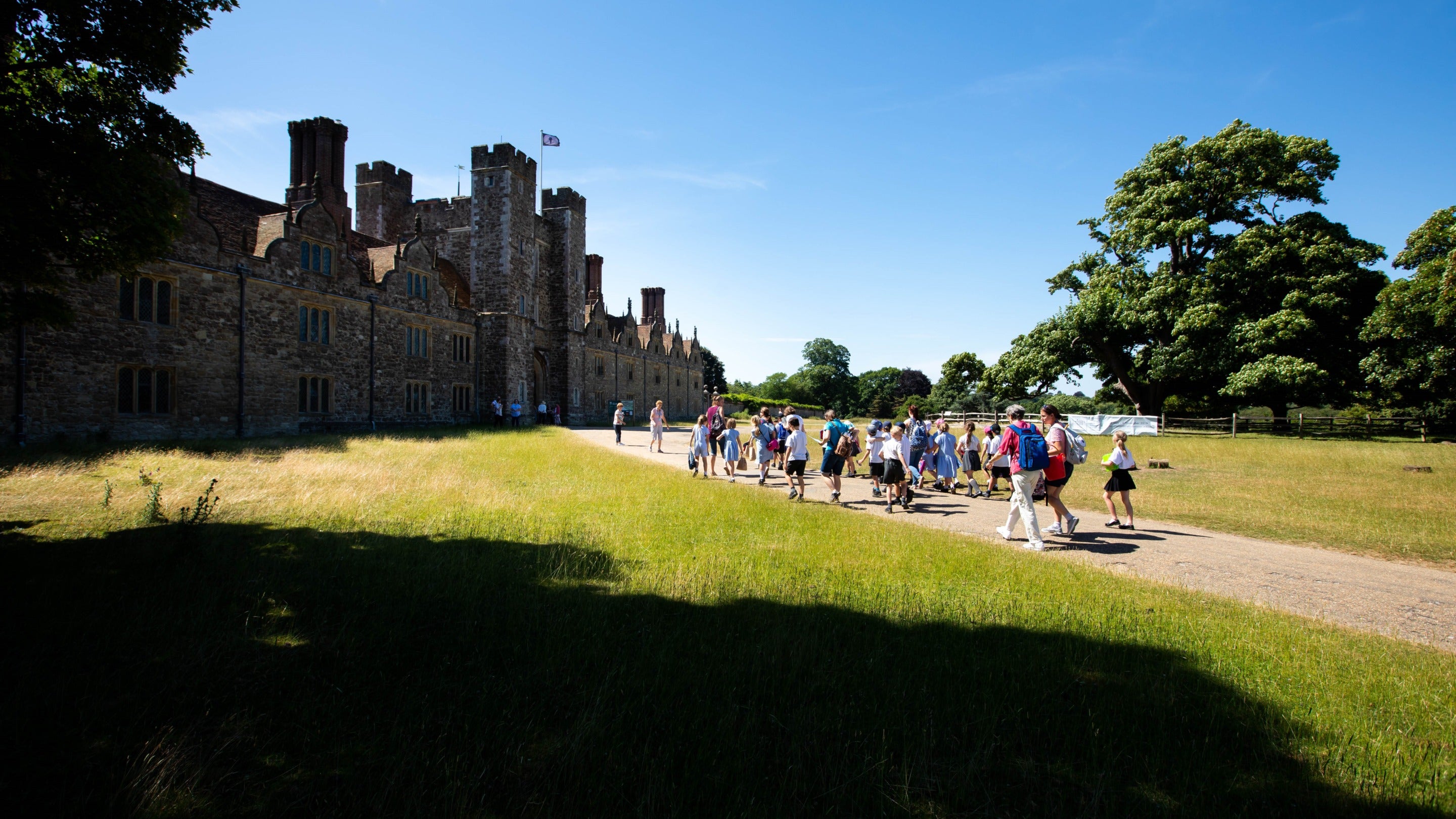 School visit walking into the parkland in front of Knole House, Kent