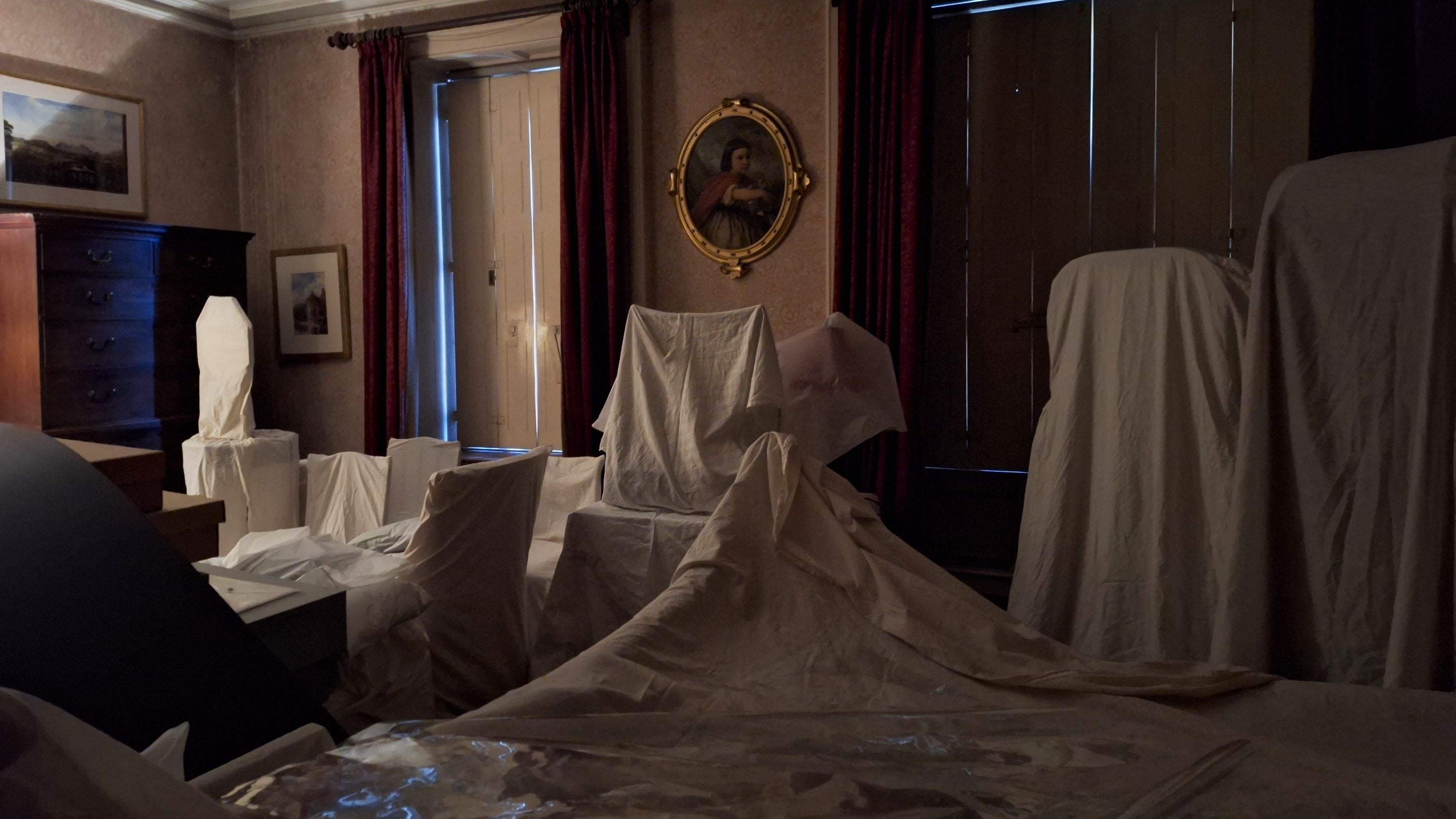 The Red Bedroom at Scotney Castle in the process of being 'put to bed' to help conserve the collection.