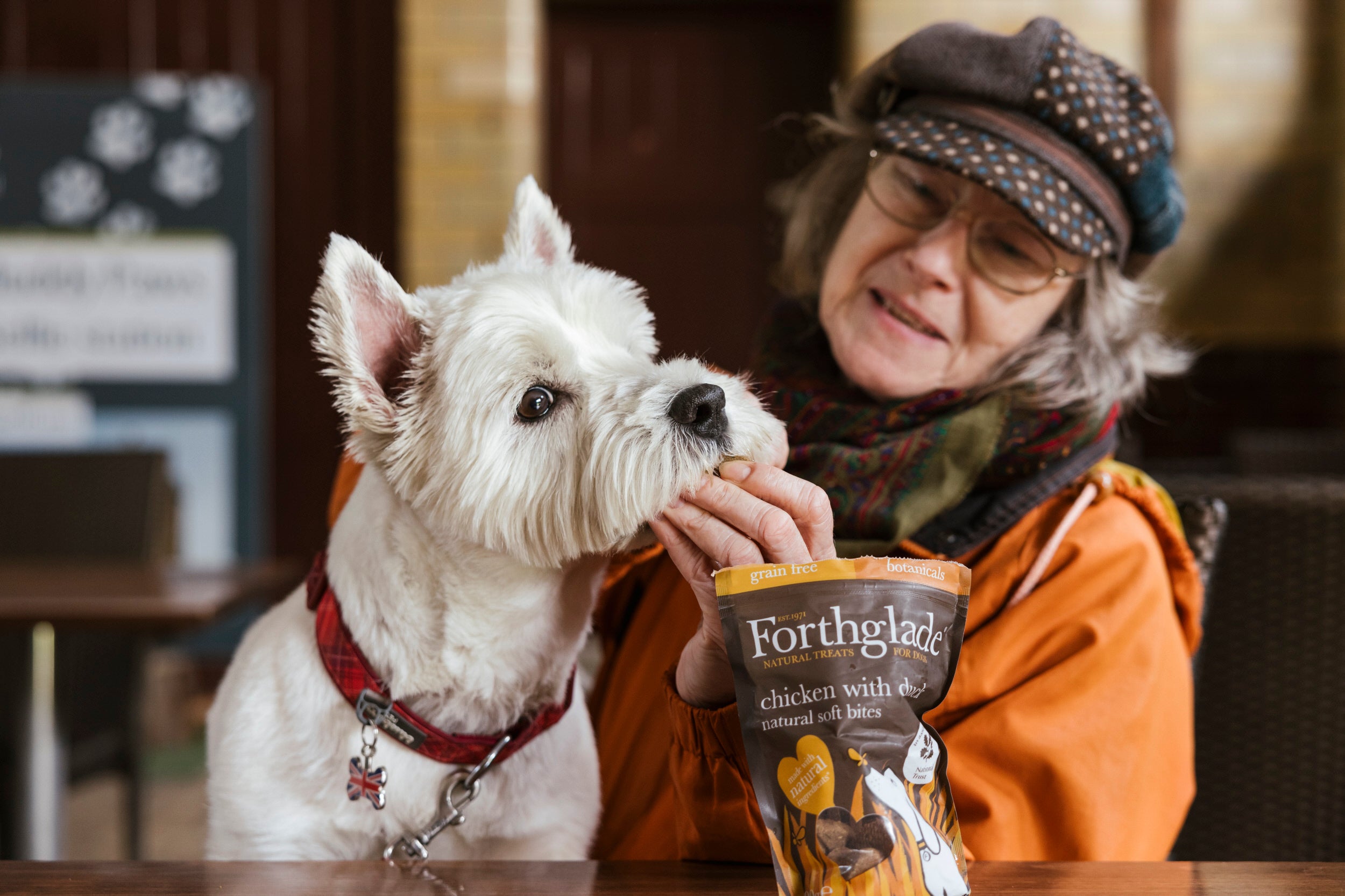 A dog and owner enjoying their snack break