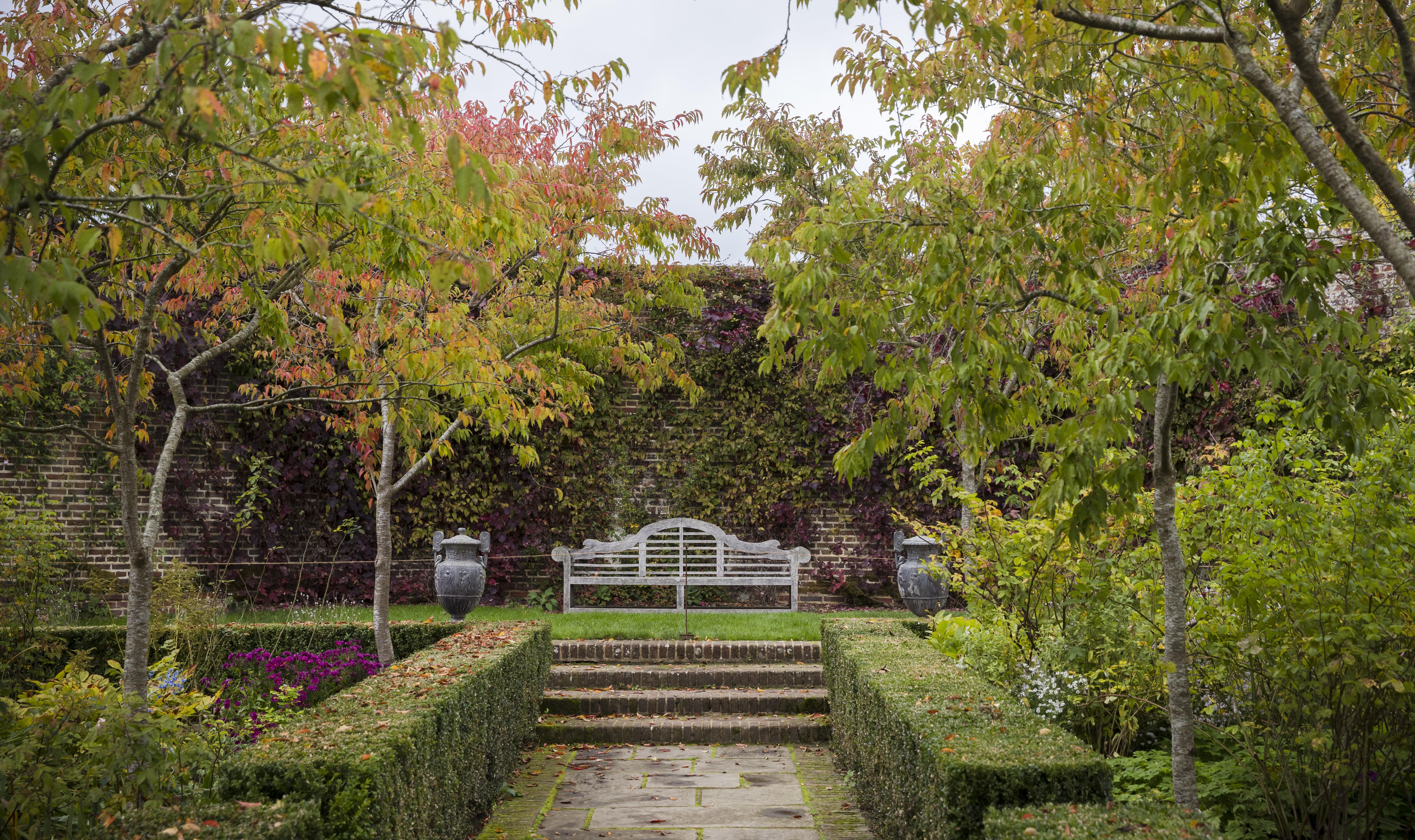 Orange, brown and green colours in the rose garden at Sissinghurst