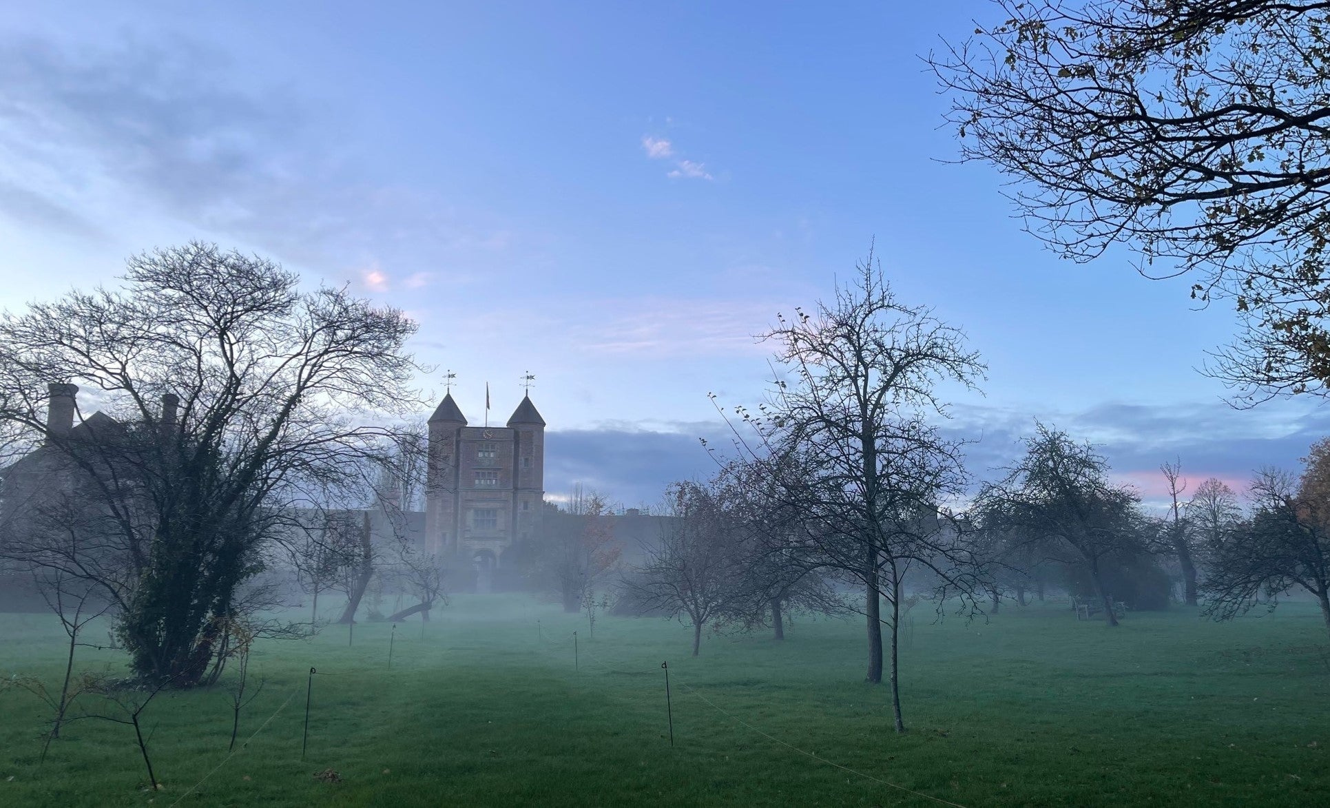 November mist in the orchard with the Elizabethan Tower in the background