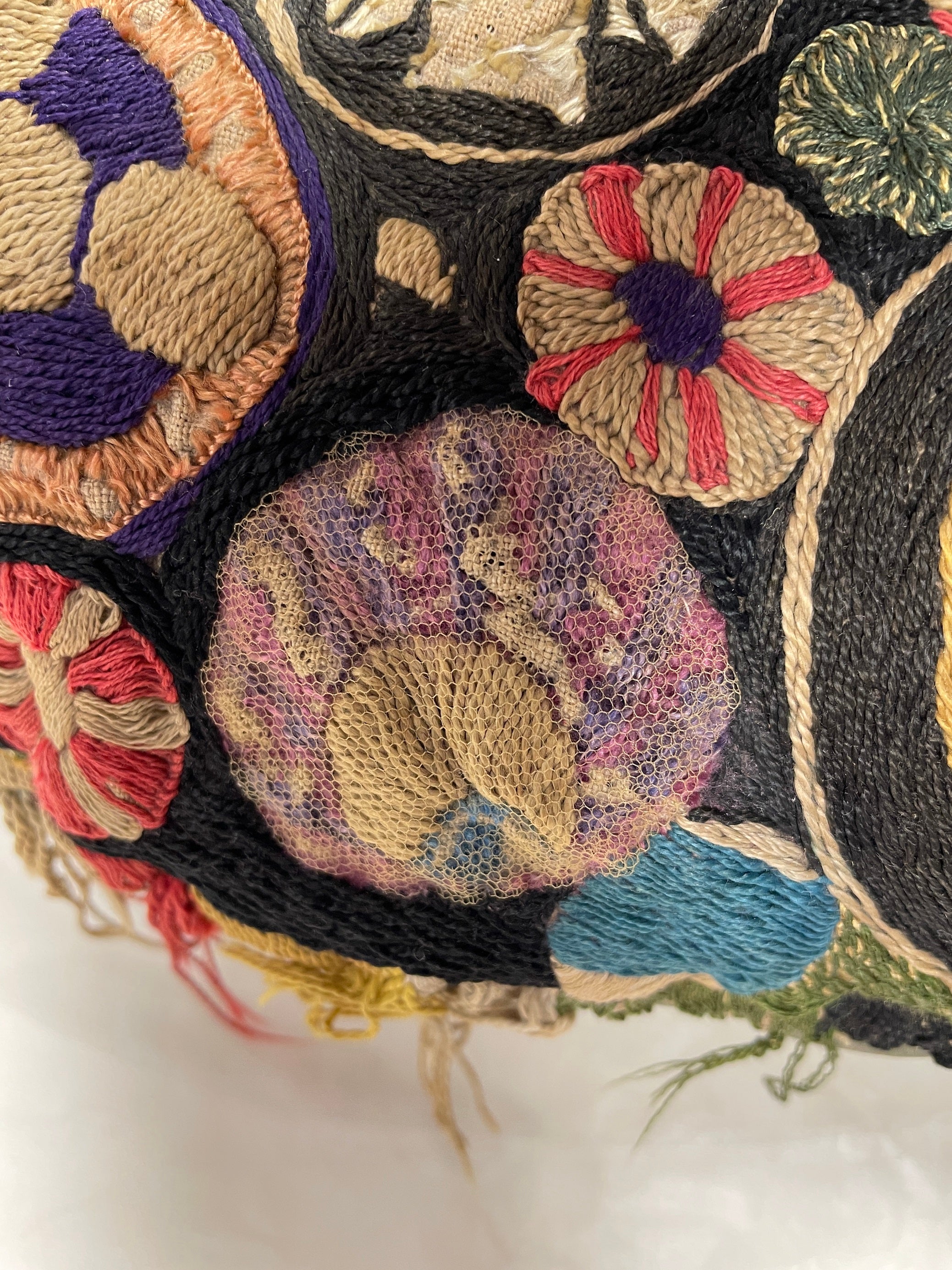 Area of loose embroidery after netting